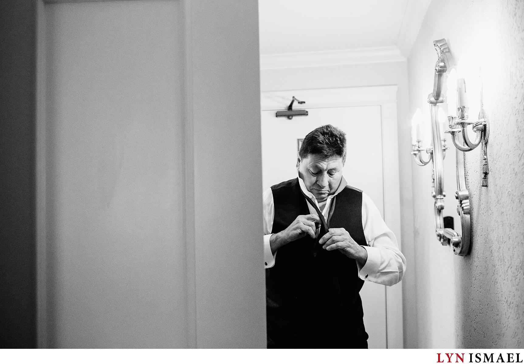 Groom gets ready before his wedding ceremony at the Old Mill Inn in Toronto