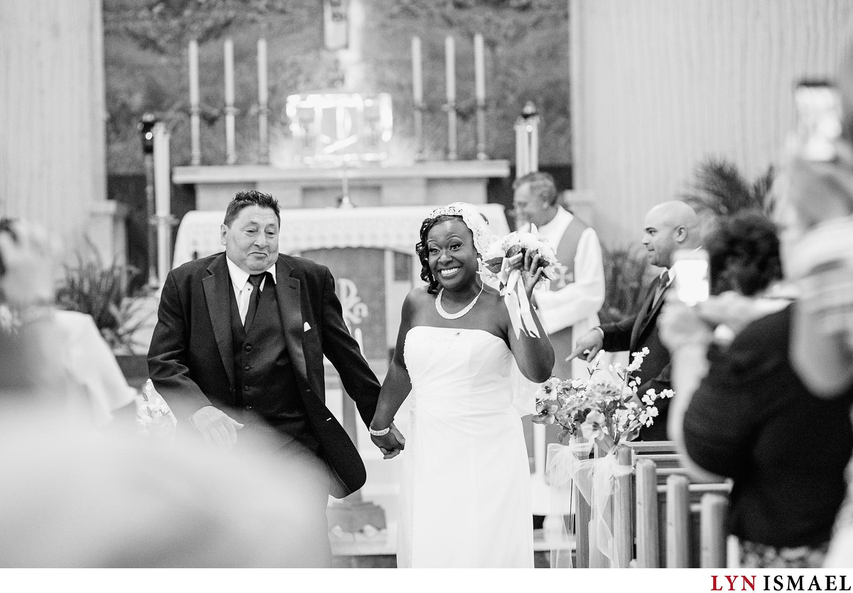 Bride and groom dances at their recessional after their wedding ceremony