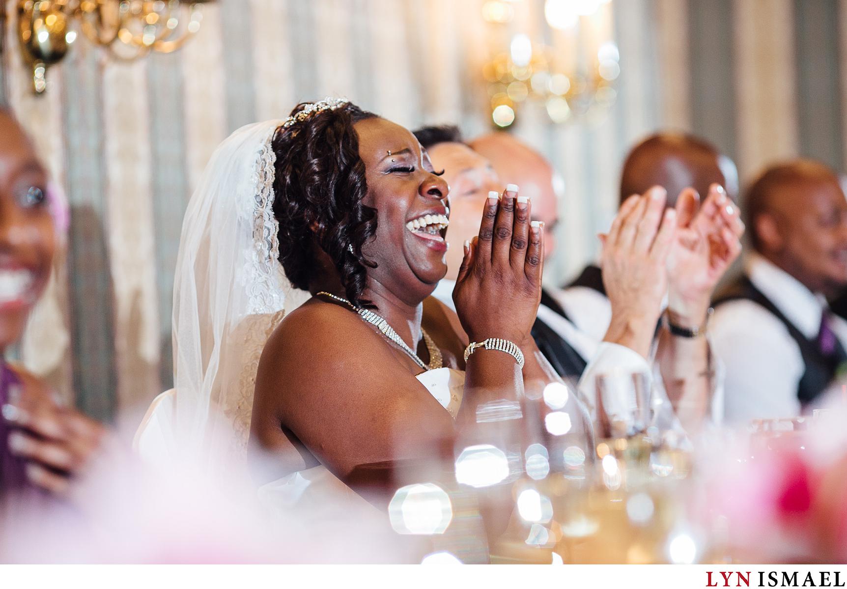 Bride's reaction to the maid of honour's funny anecdote.