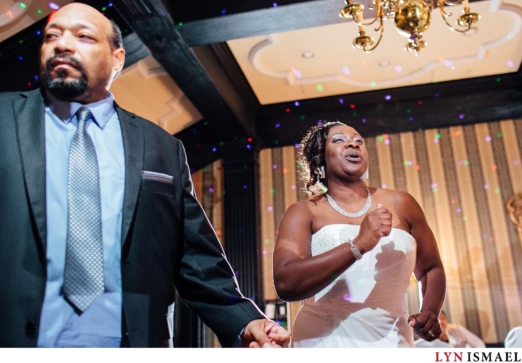 African-American bride dancing at her wedding reception at the Old Mill Inn in Toronto