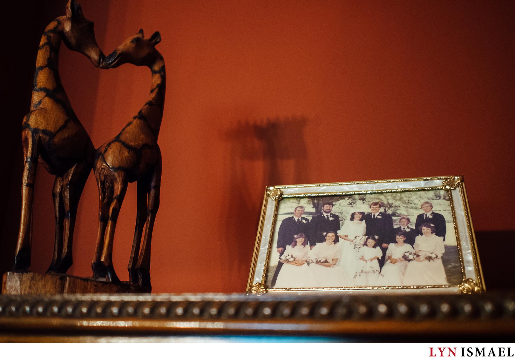 Bride's parent's wedding photo and a giraffe sculpture