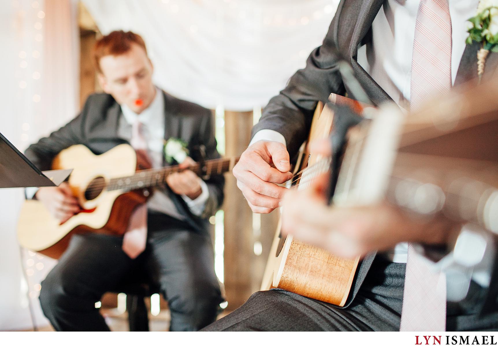 Bride's brothers strumming the guitar