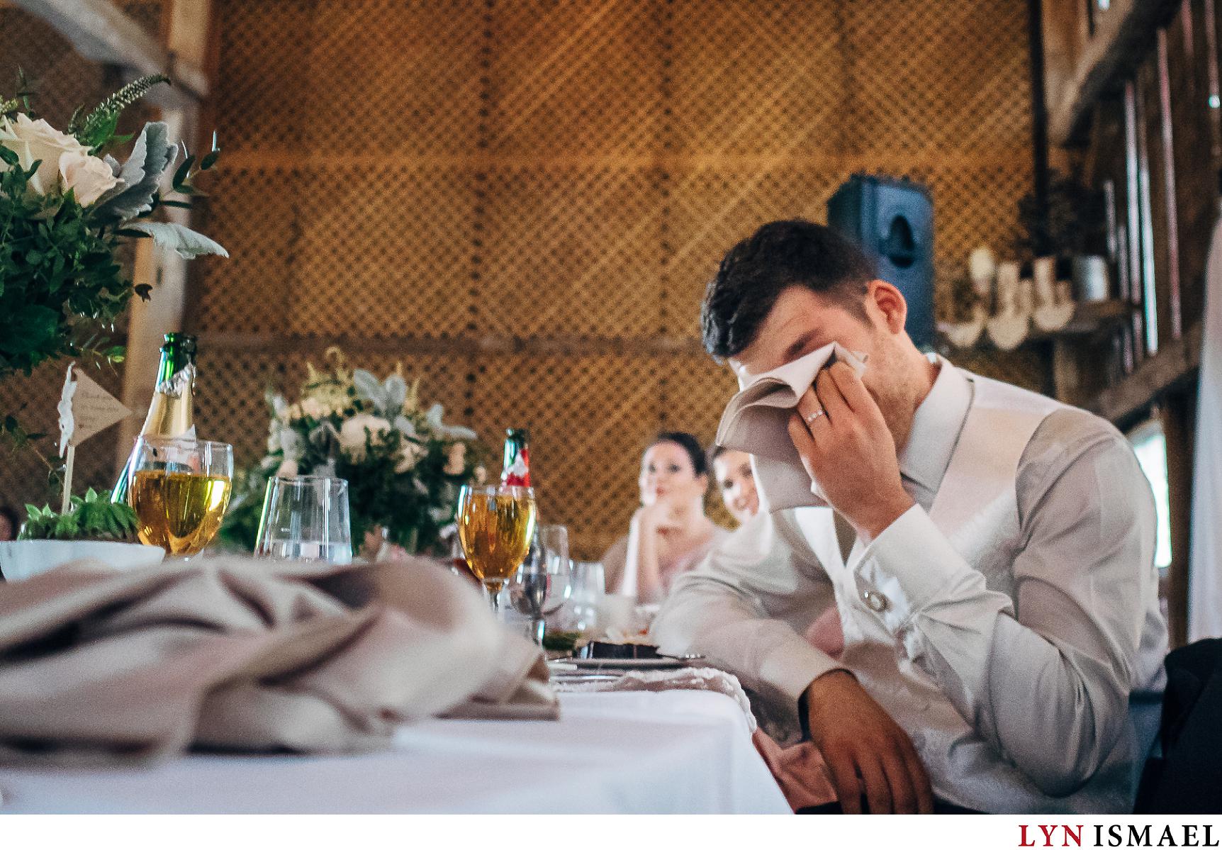 The groom cries at his wedding reception