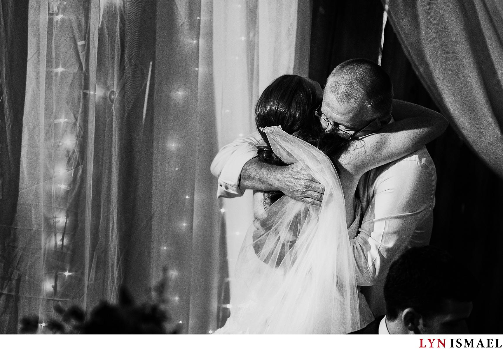 Bride and her father hugs