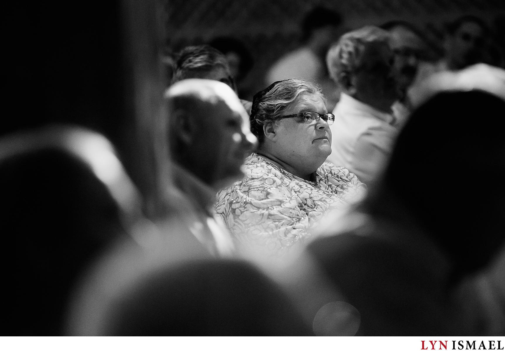 Mother of the groom listens