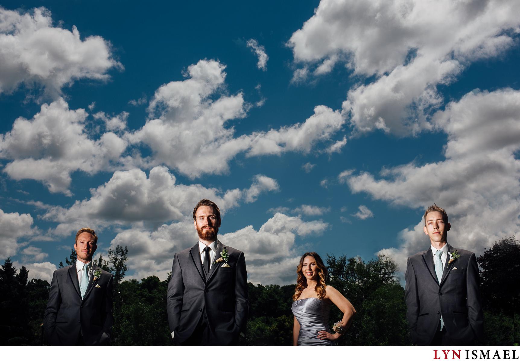 Flash composite portraiture featuring the groom and his groomsmen at a Waterloo Region wedding.