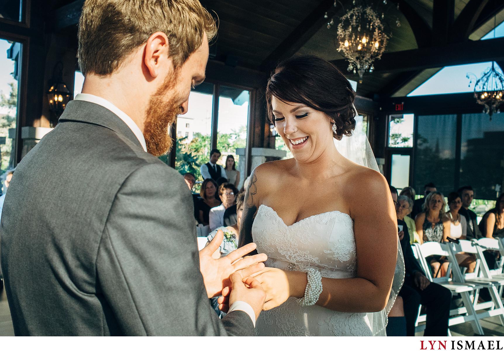 Bride and groom exchange rings at a Waterloo Region wedding.