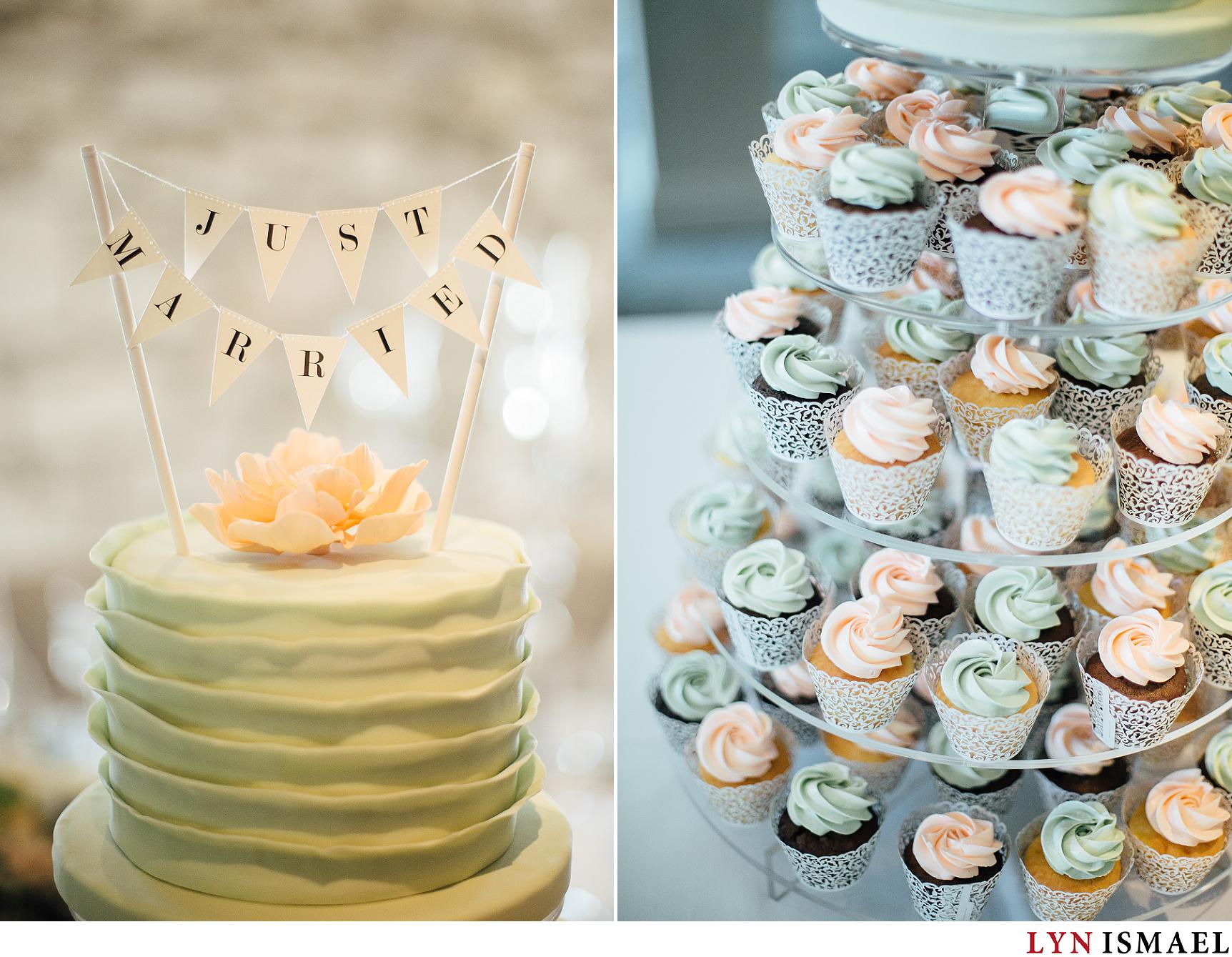 Modern cake topper with mint and cream coloured wedding cupcakes