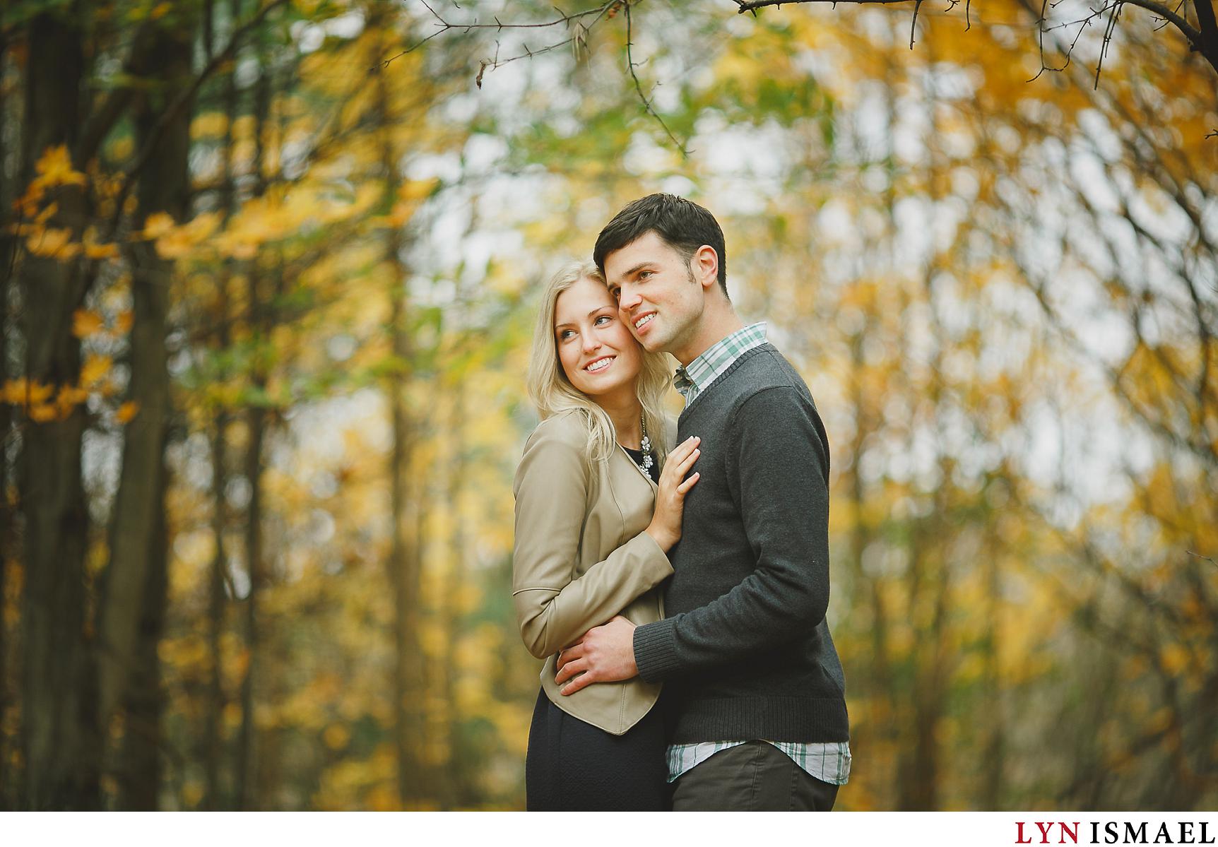 A portrait of an engaged couple taken in the fall