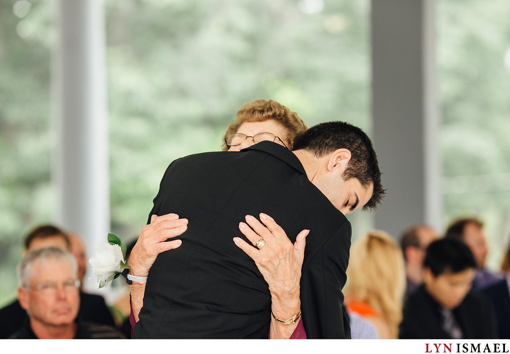 Groom hugs his grandmother