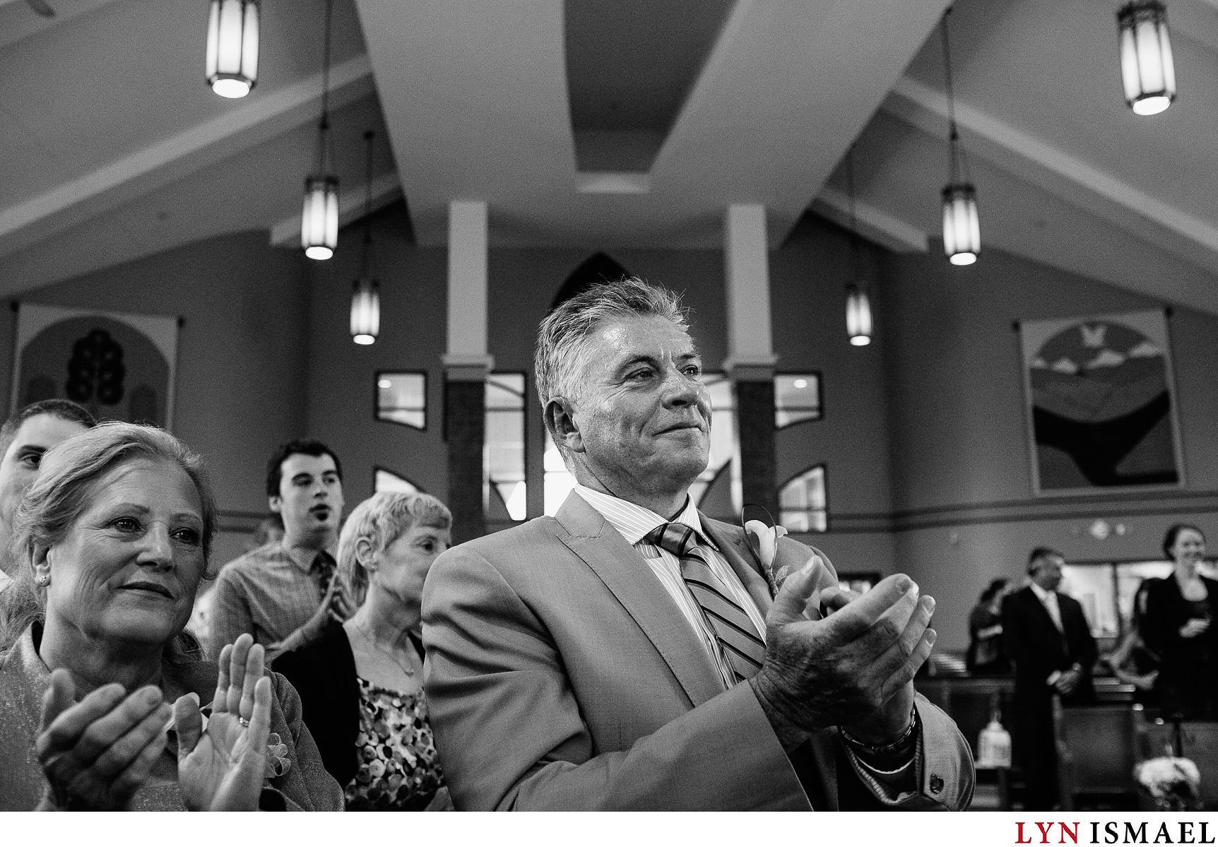 A proud father of the bride watches his daughter wed at the Immaculate Heart of Mary Roman Catholic Church in Stoney Creek, Ontario.
