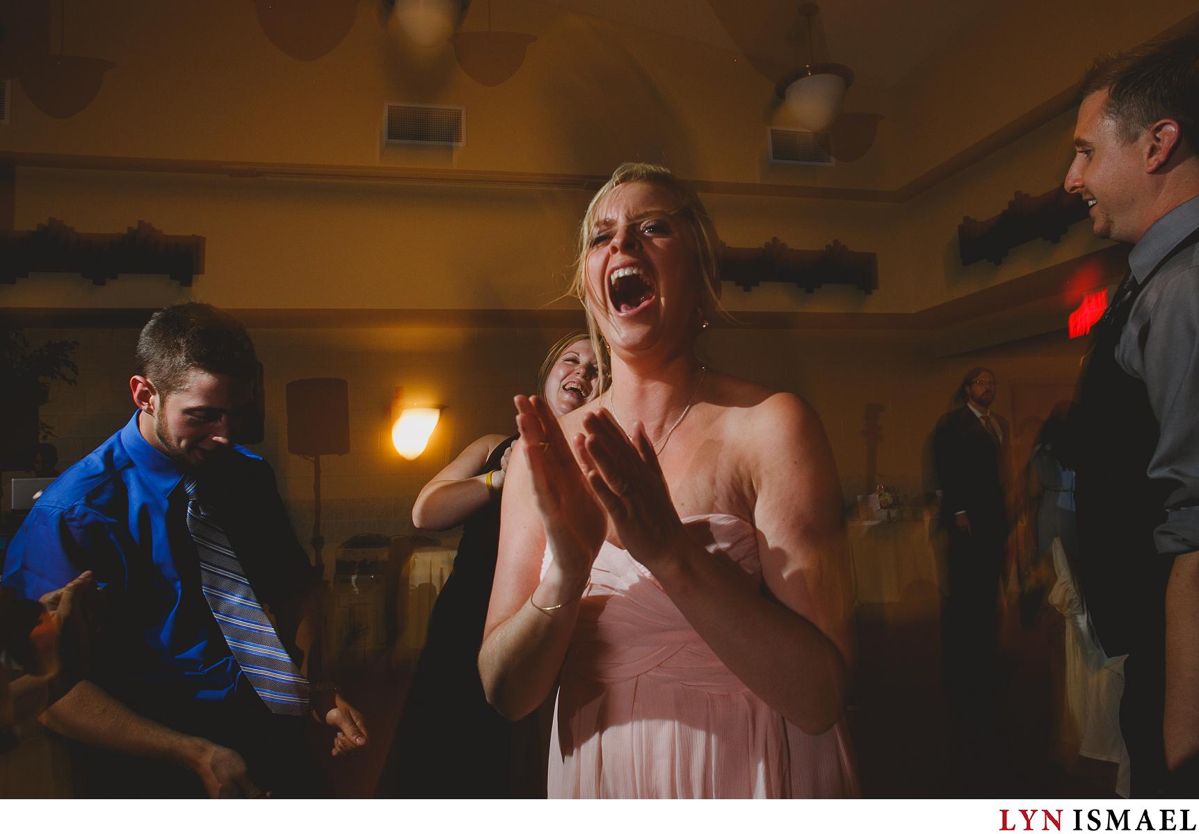 A bridesmaid dancing at her friend's wedding reception in Stoney Creek, Ontario.