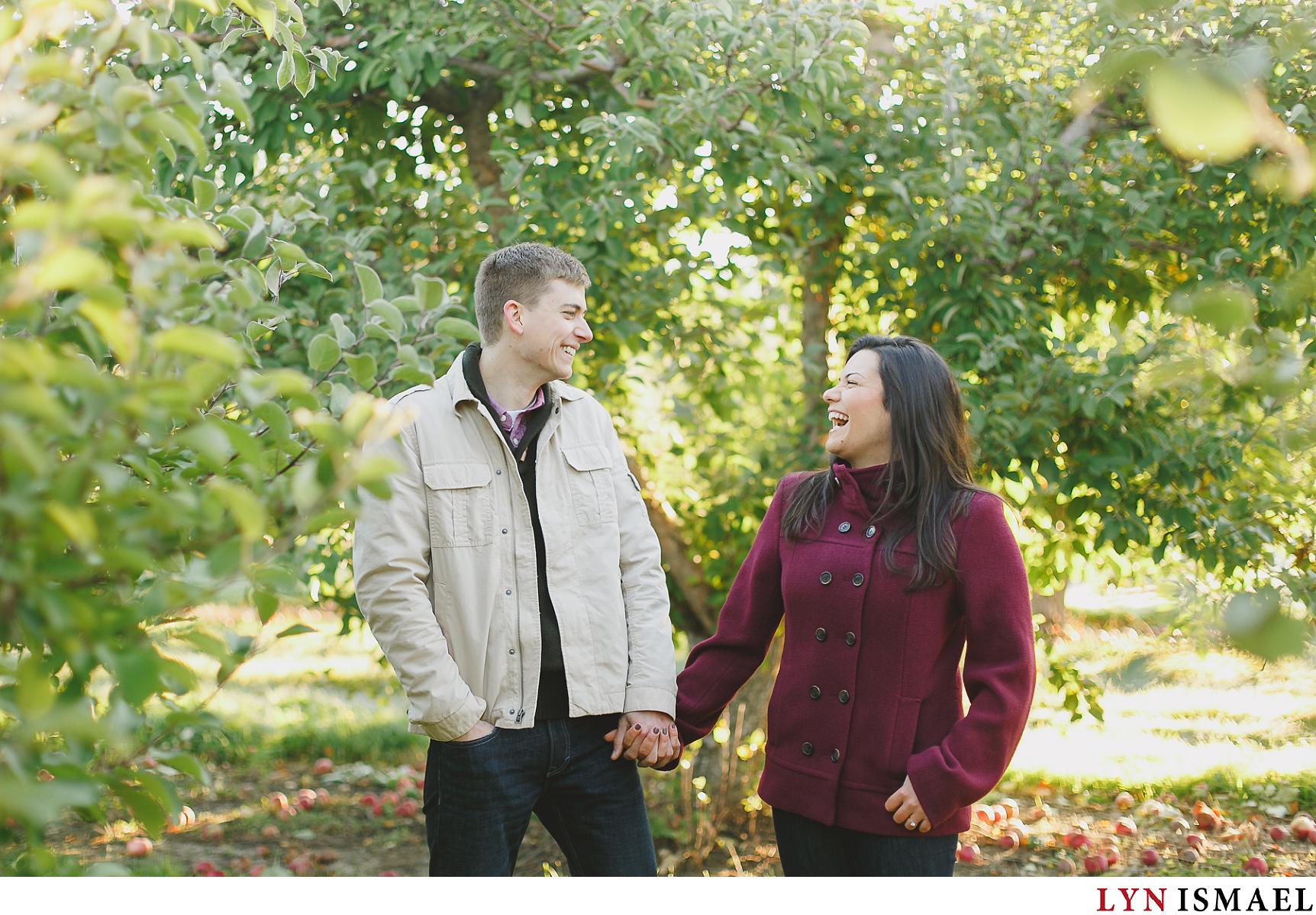 Deborah and Mike poses for their engagement session at an apple orchard in St Jacob's, Ontario