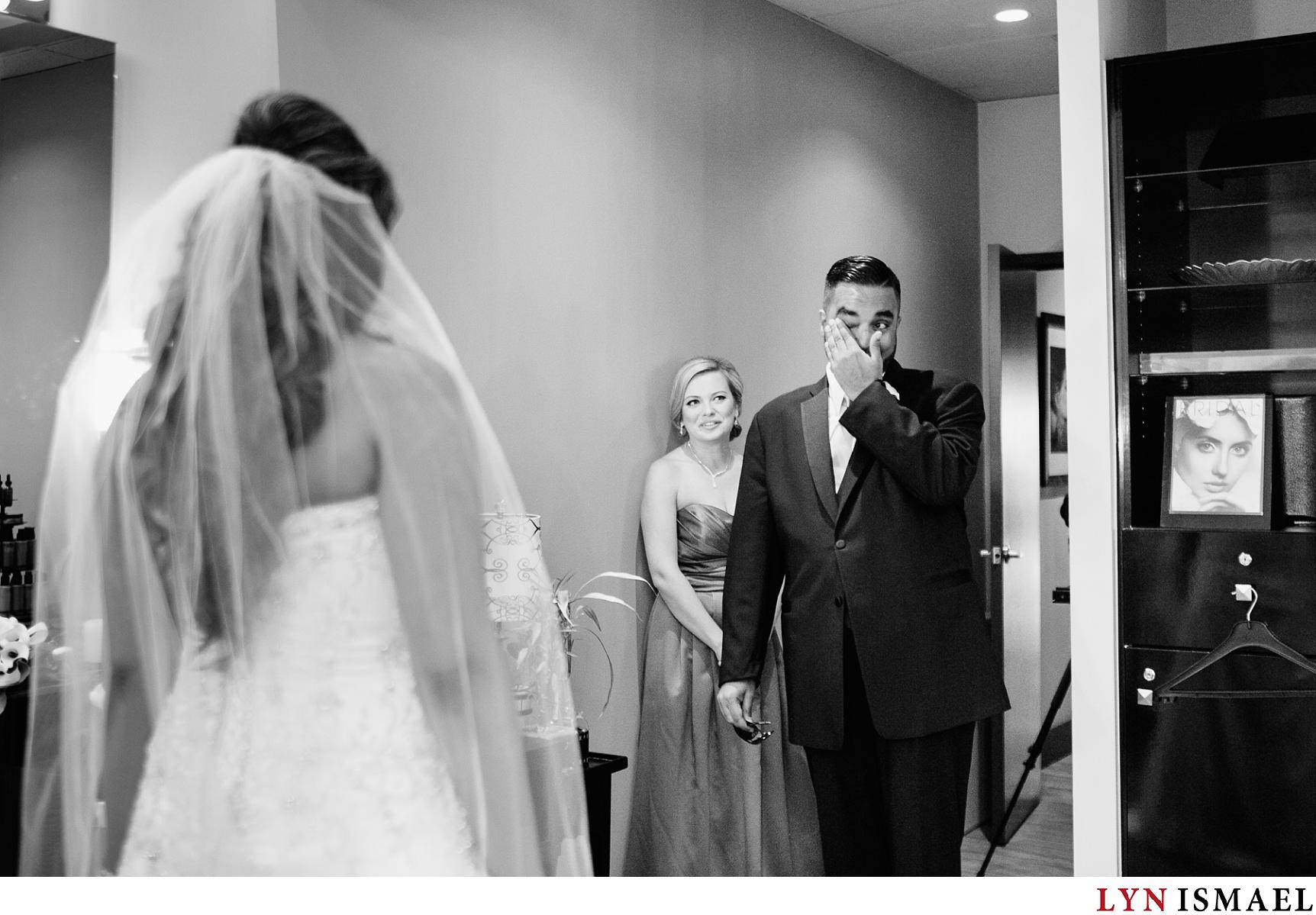 the groom becomes emotional seeing his bride.