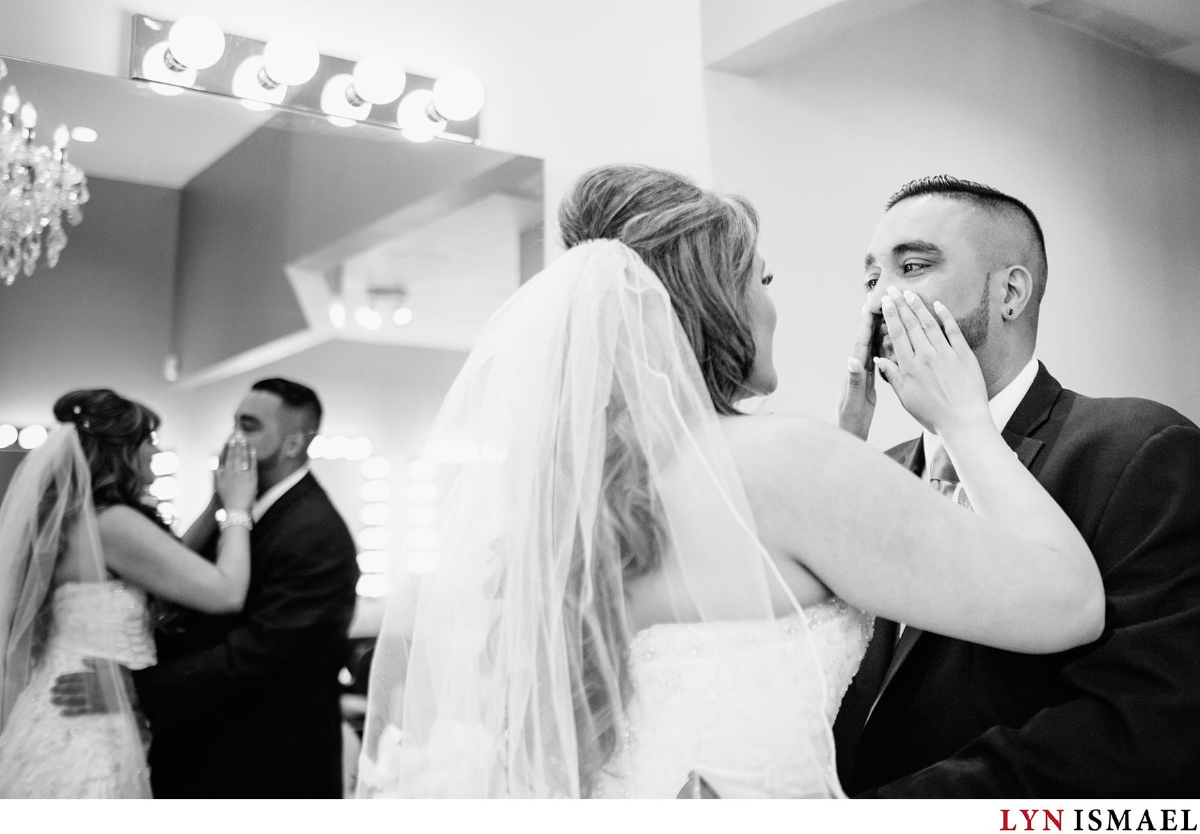 bride wipes the groom's tears