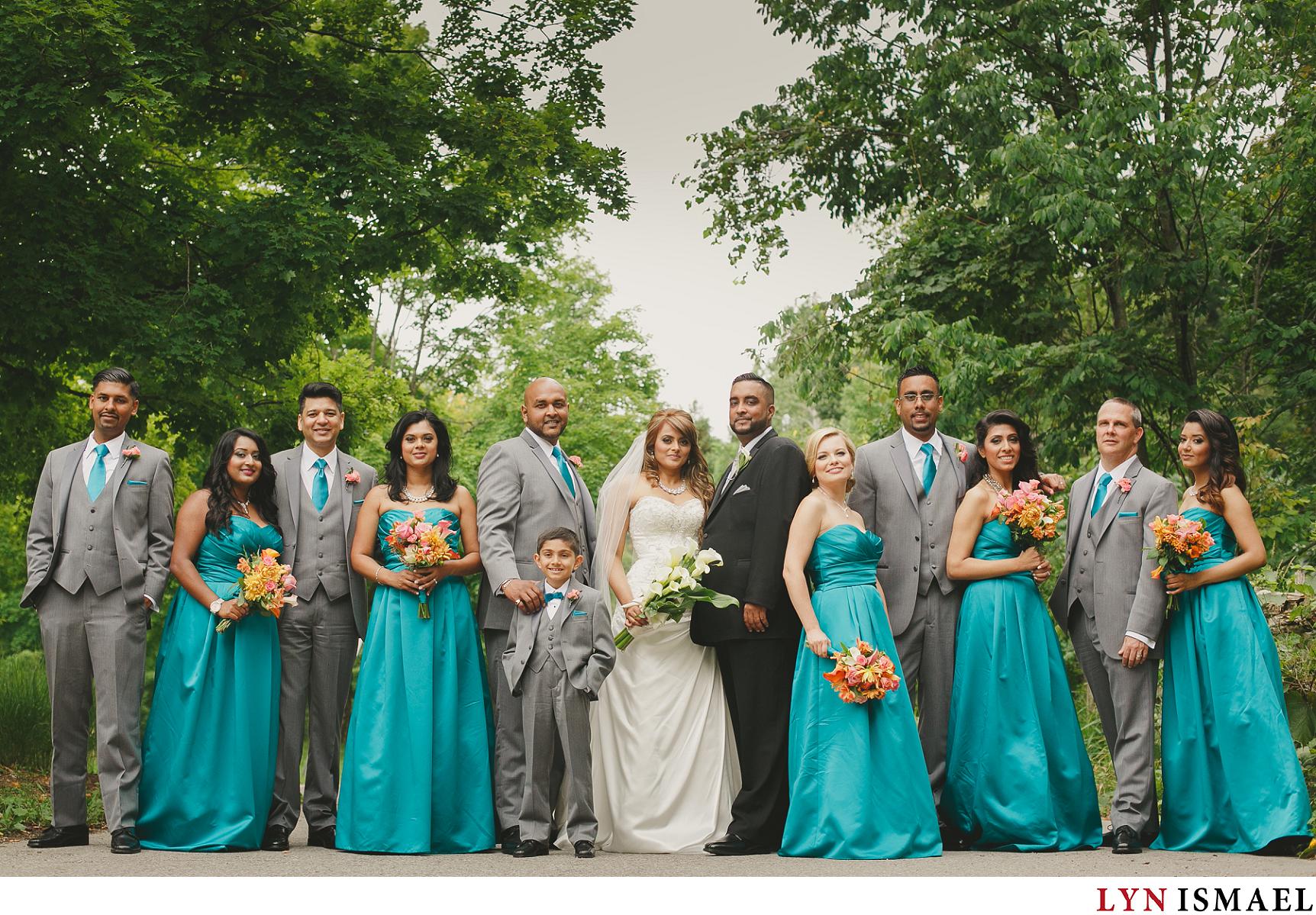 Wedding party in teal and orange colours.