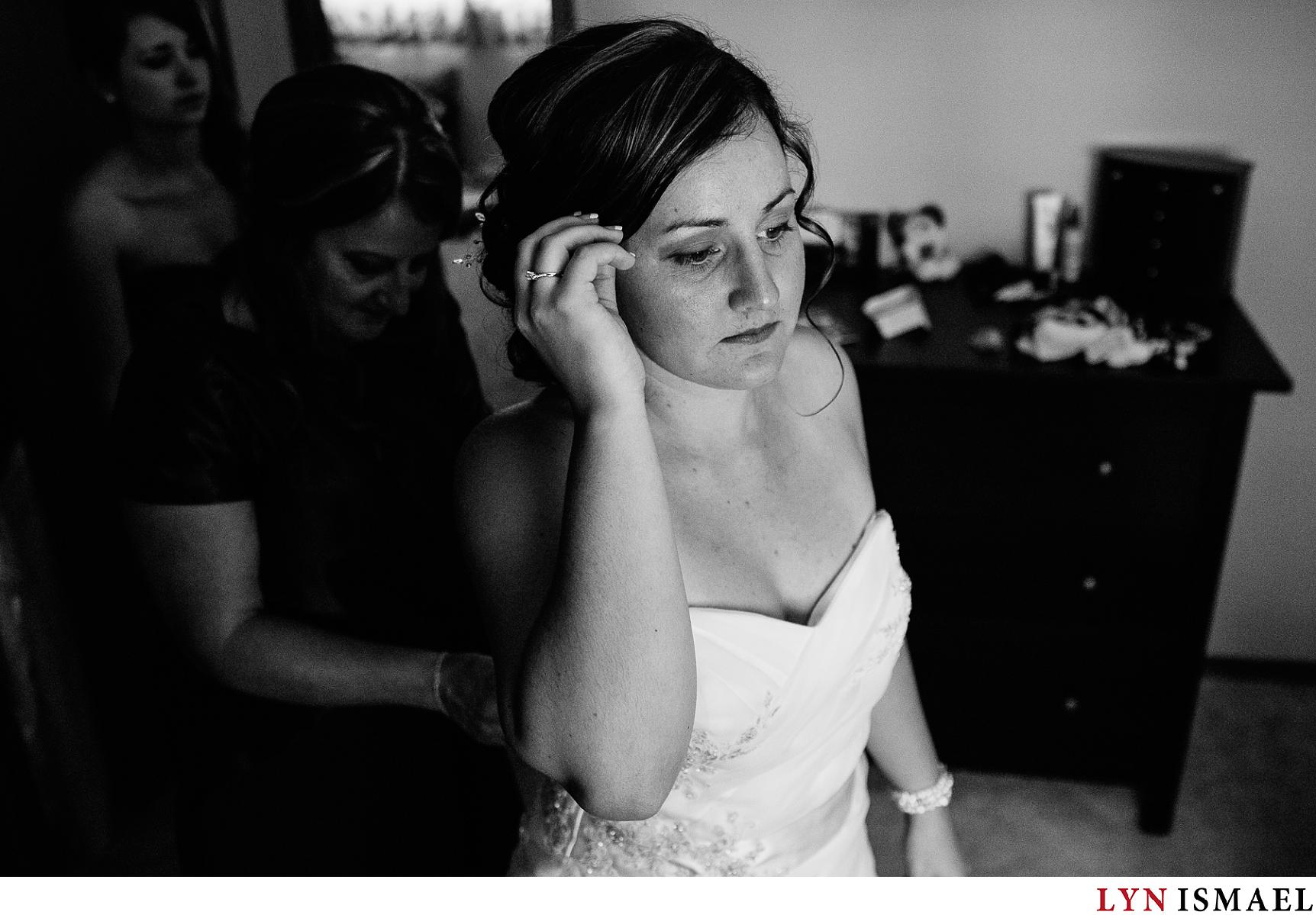 Bride gets ready before her wedding ceremony in Elora, Ontario.