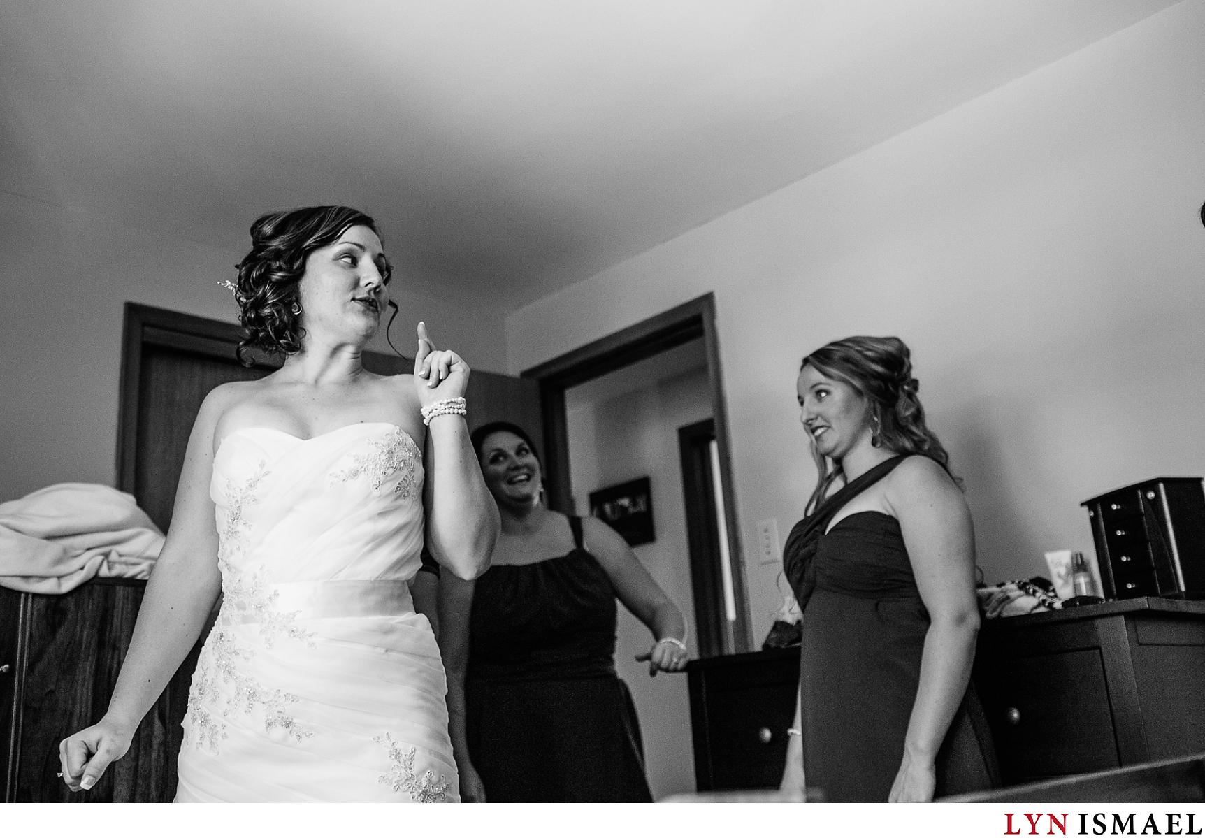 Bride gets ready and is helped by her bridesmaids.