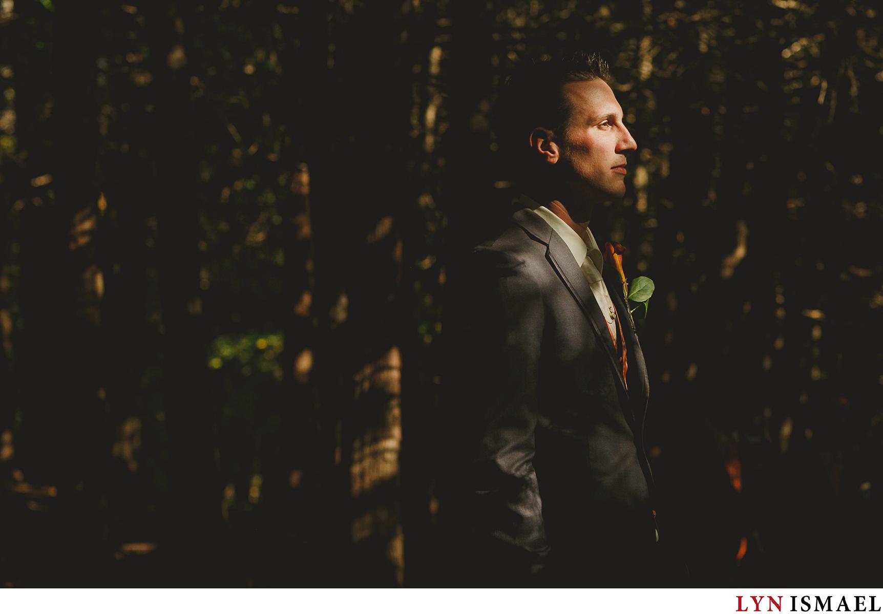 dramatically lit portrait of the groom in Elora, Ontario.