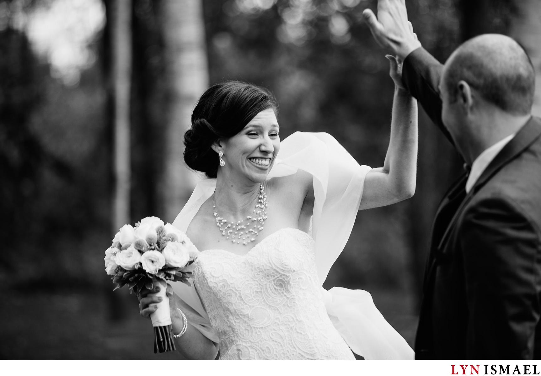 Bride and groom high fives each other
