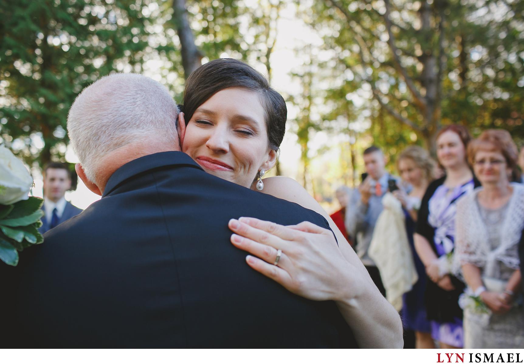 Bride hugs her father as he gave her away at their Holland Marsh Wineries wedding