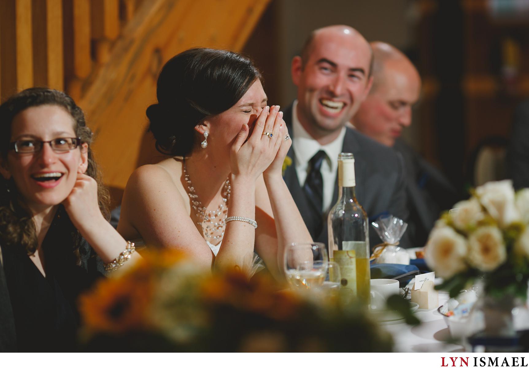 Bride reacts to the father of the groom's speech at their Holland Marsh wedding