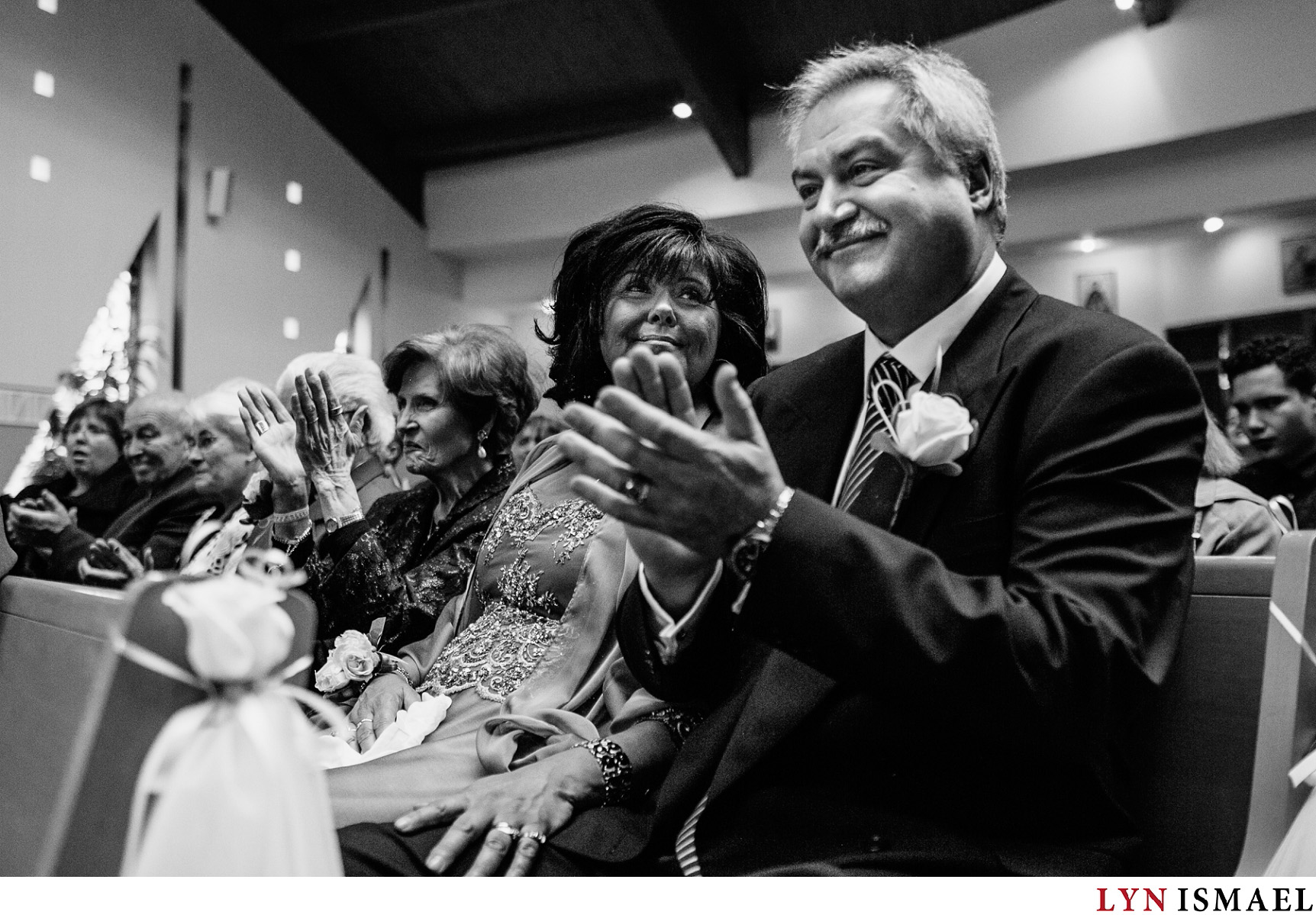 Wedding photojournalist in Vaughan, Ontario captured the groom's parents reaction at a wedding ceremony.