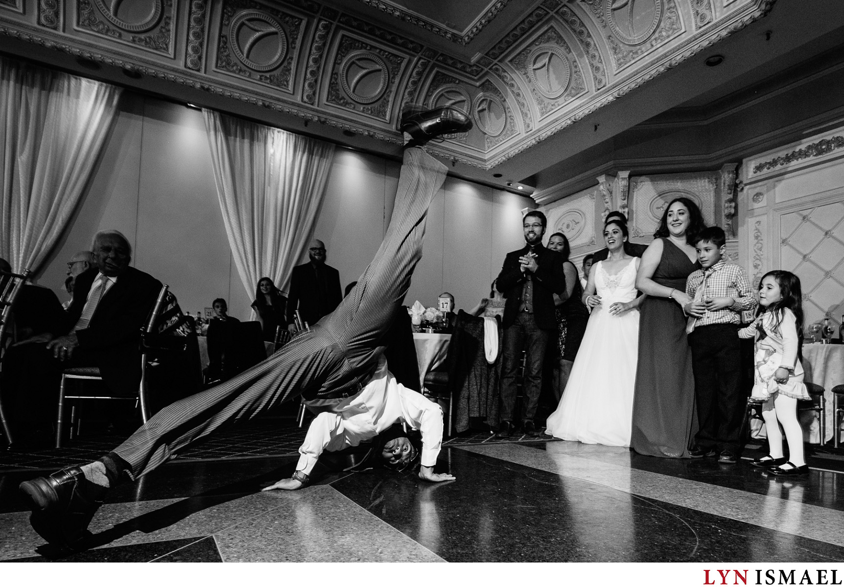 A flexible wedding guest busts a move at a wedding reception in Vaughan, Ontario.