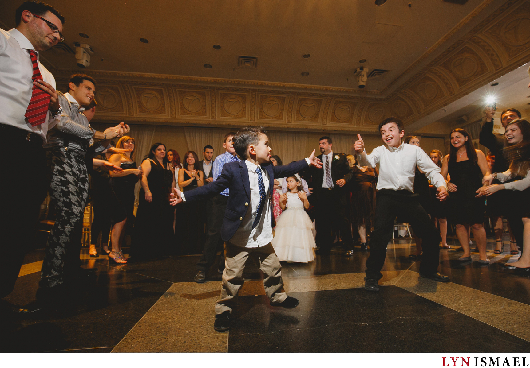 Young boys showing their moves on the dance floor at Paradise Banquet Hall as documented by a Vaughan wedding photojournalist.