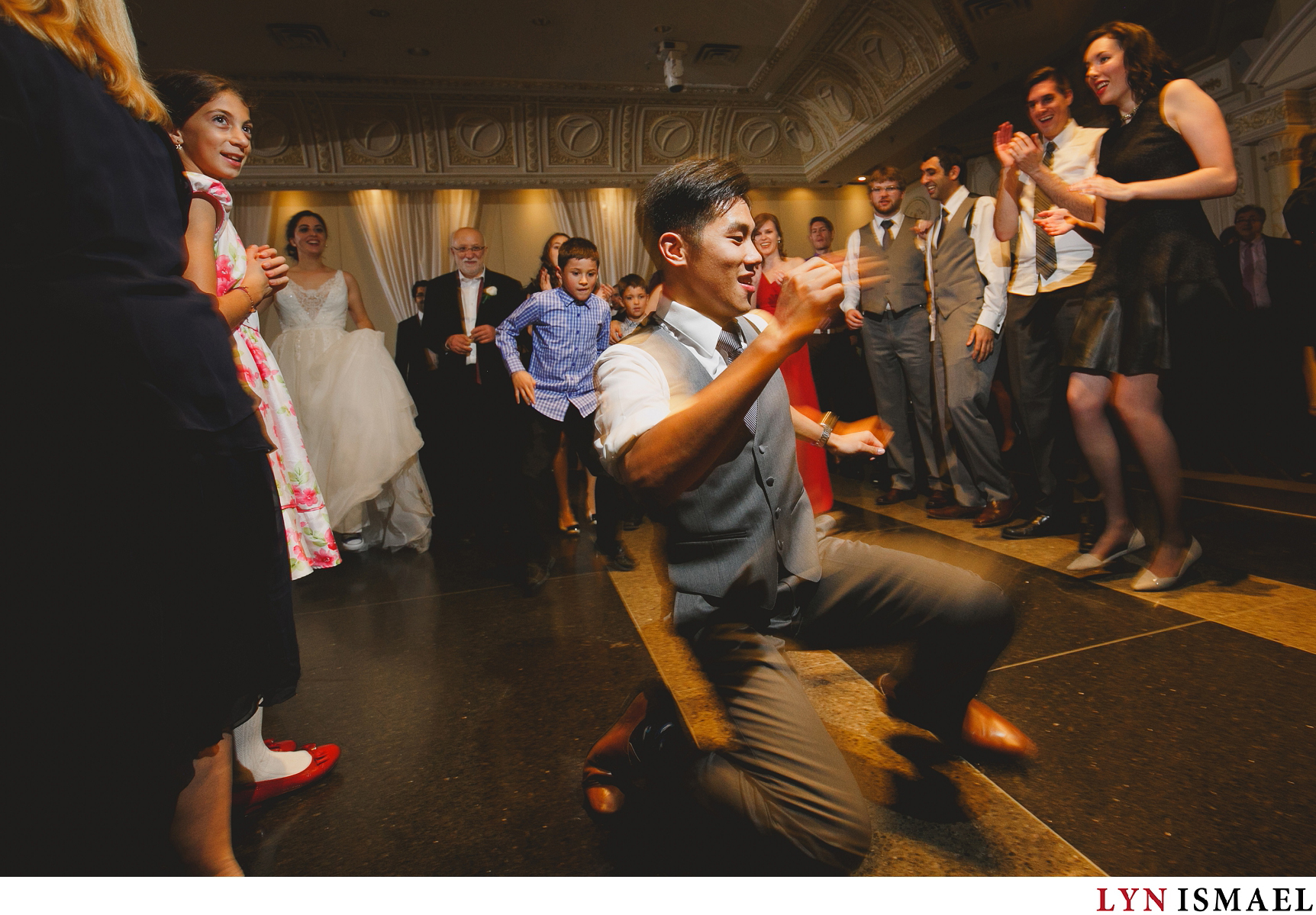 Vaughan wedding photojournalist captured a groomsman dancing at a wedding reception in Paradise Banquet Hall.