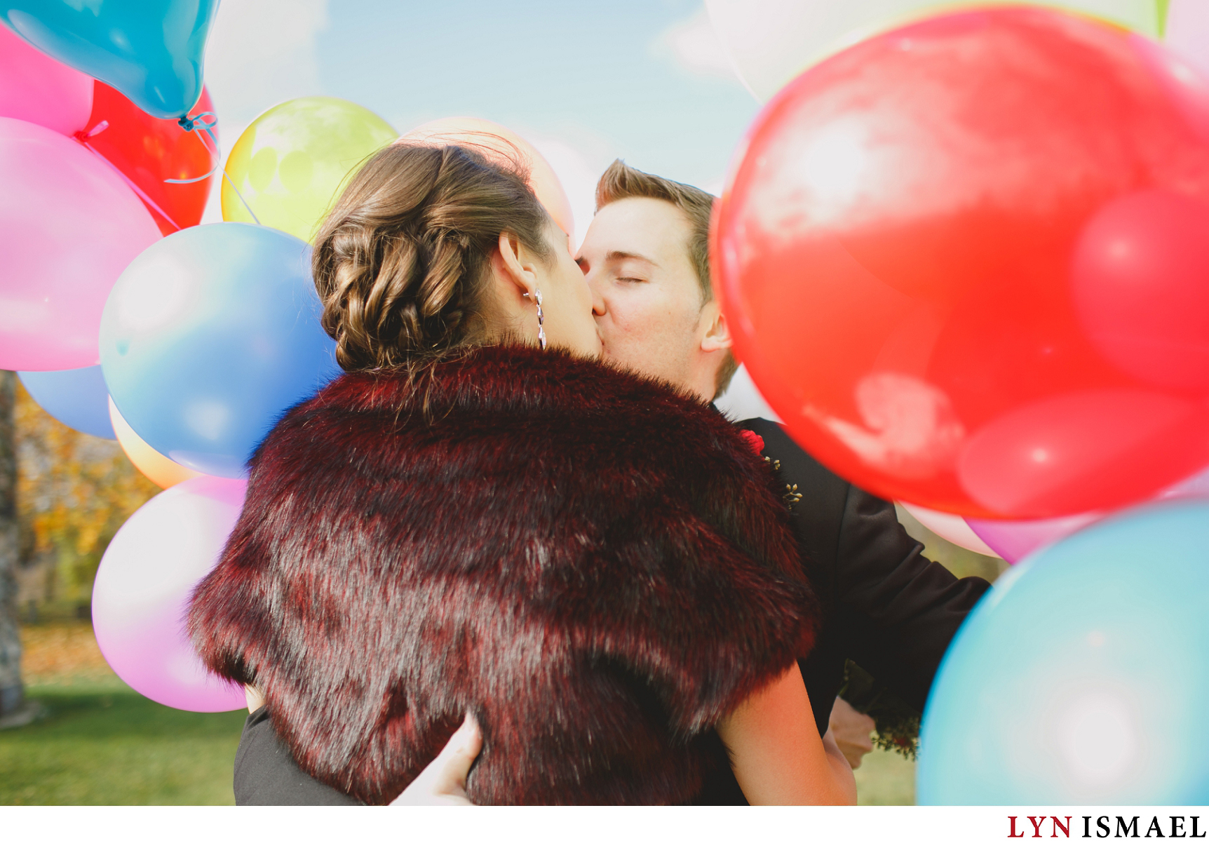 The bride and groom's "Up Themed" First Look with colourful balloons.