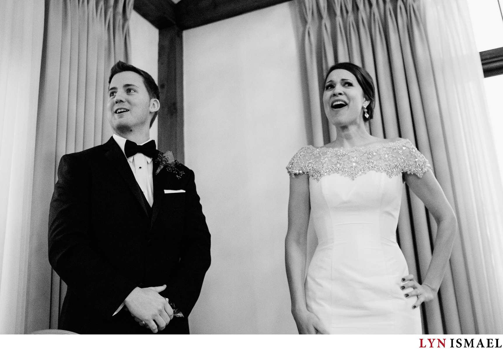 Reaction of the bride and groom after drinking a shot of vodka.