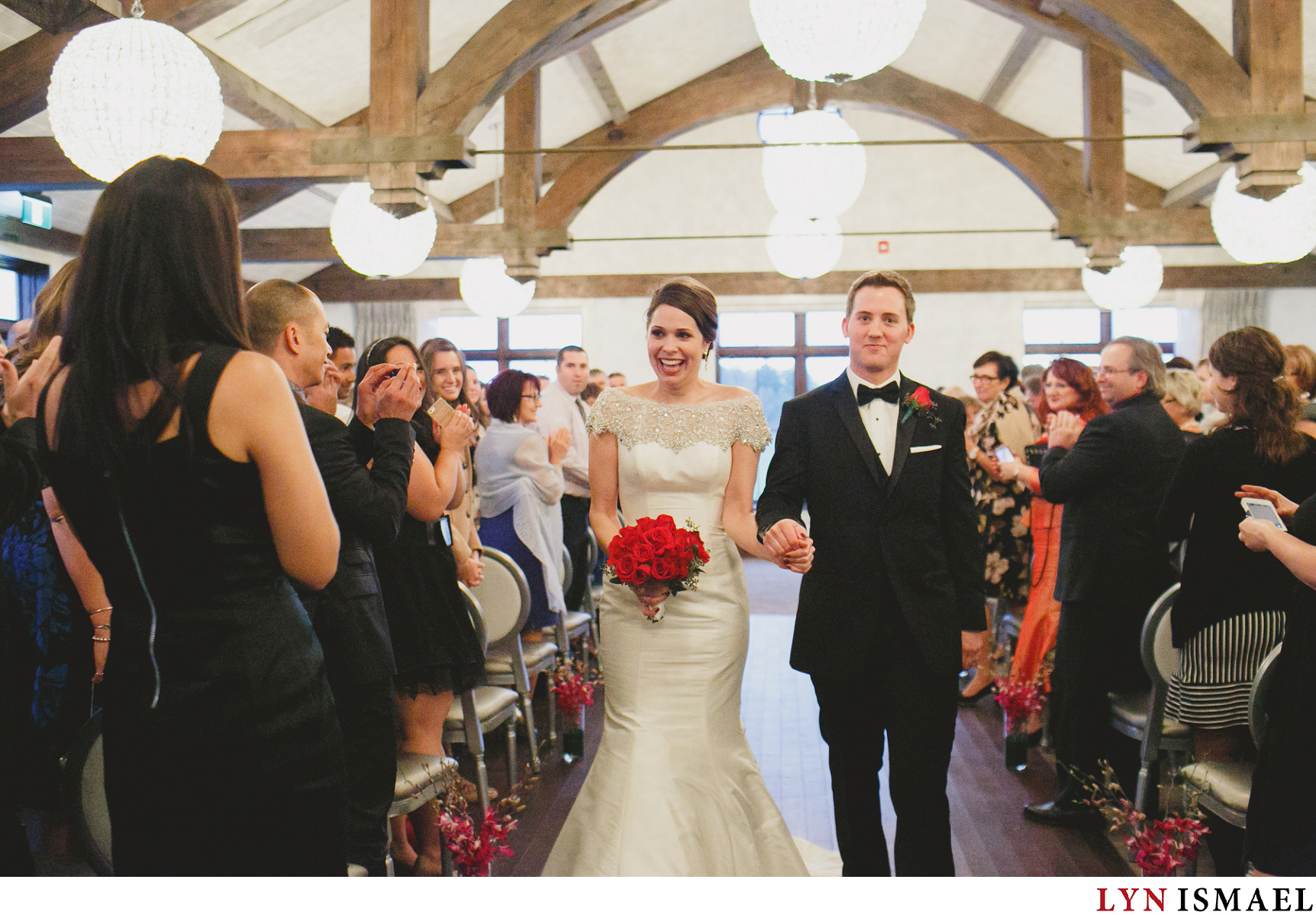 Bride and Groom recessional at the Rose Room in Whistle Bear Golf Club