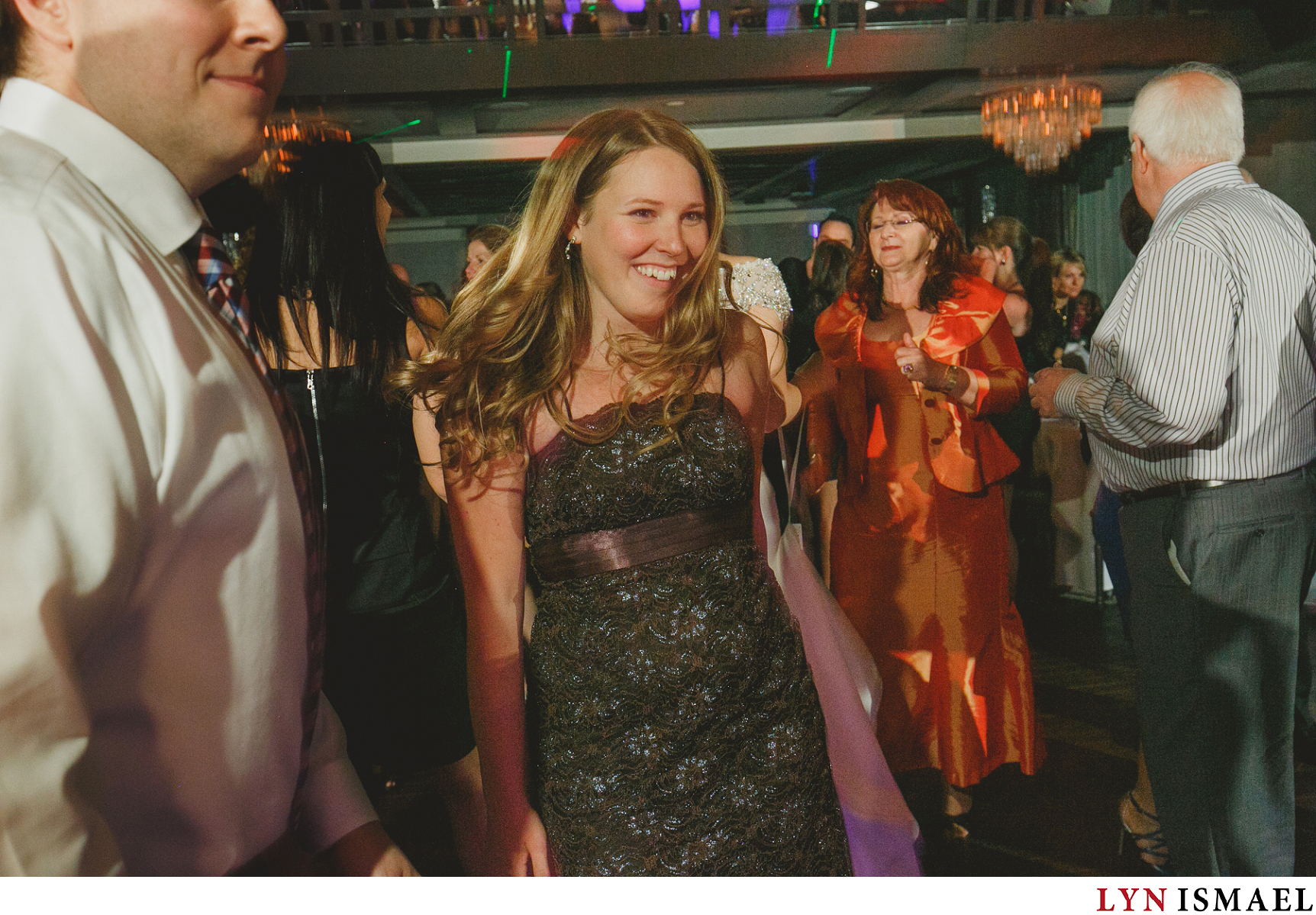 A young woman dances with the other wedding guests at Cambridge's newest wedding venue, Whistle Bear Golf Club.