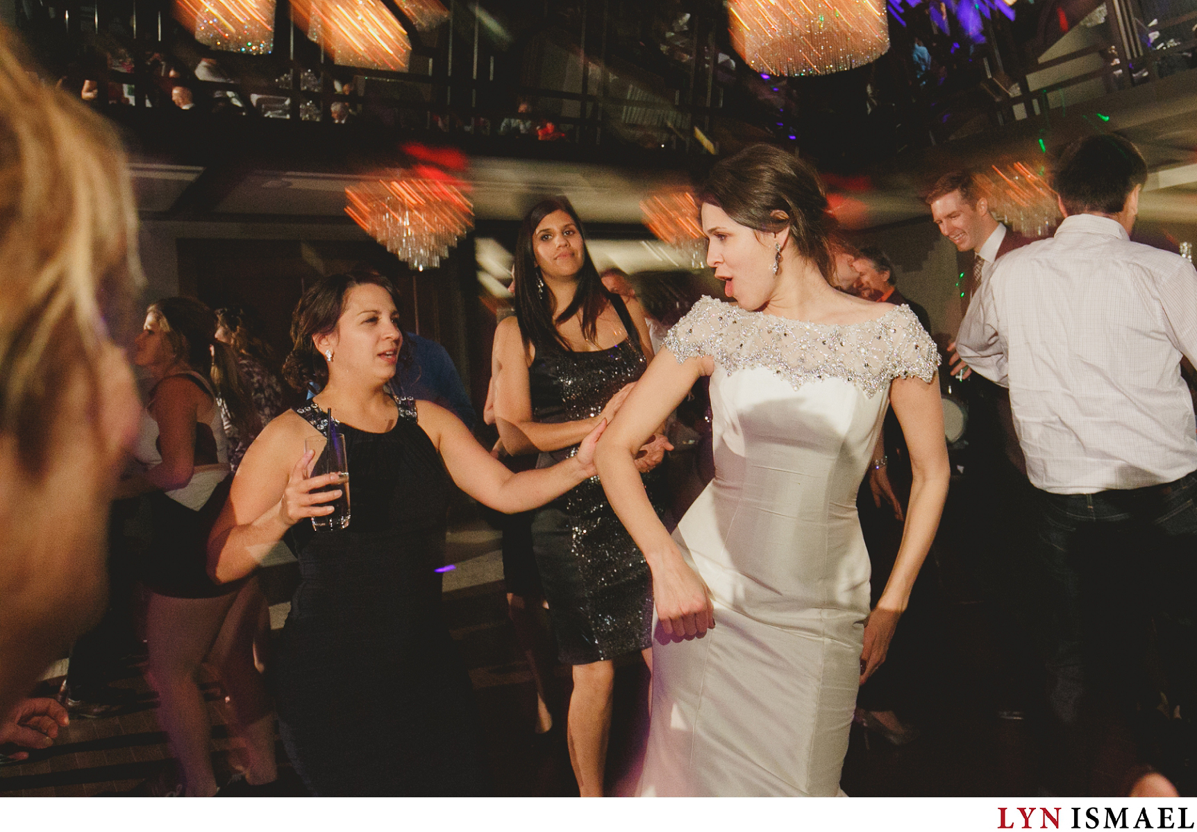 The bride dances with her friends at her wedding reception at Whistle Bear Golf Club