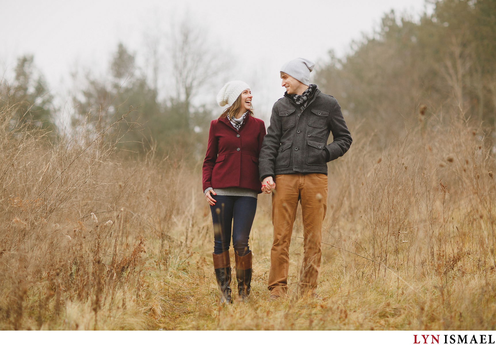 A couple in the middle of a field in the winter