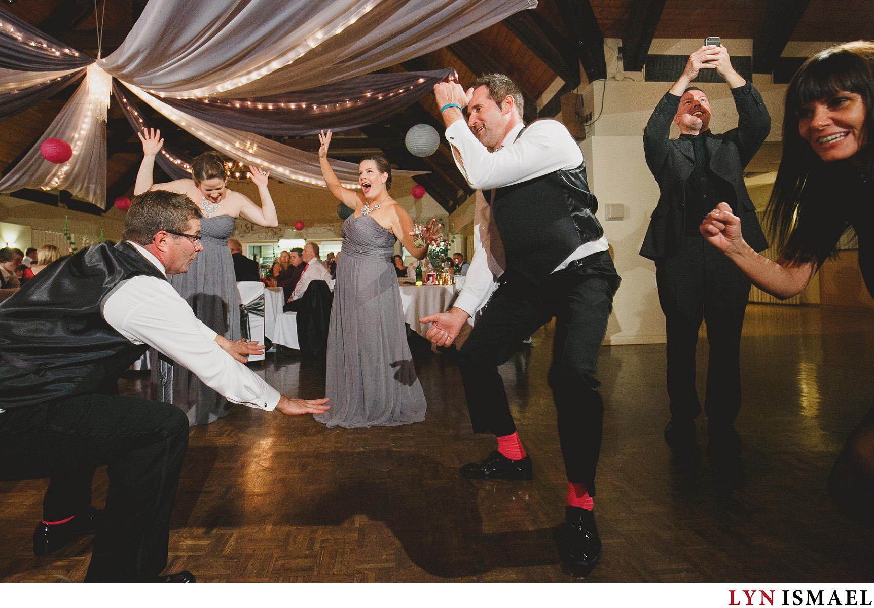 Groomsmen and Bridesmaids dance to a tune at Concordia Club.