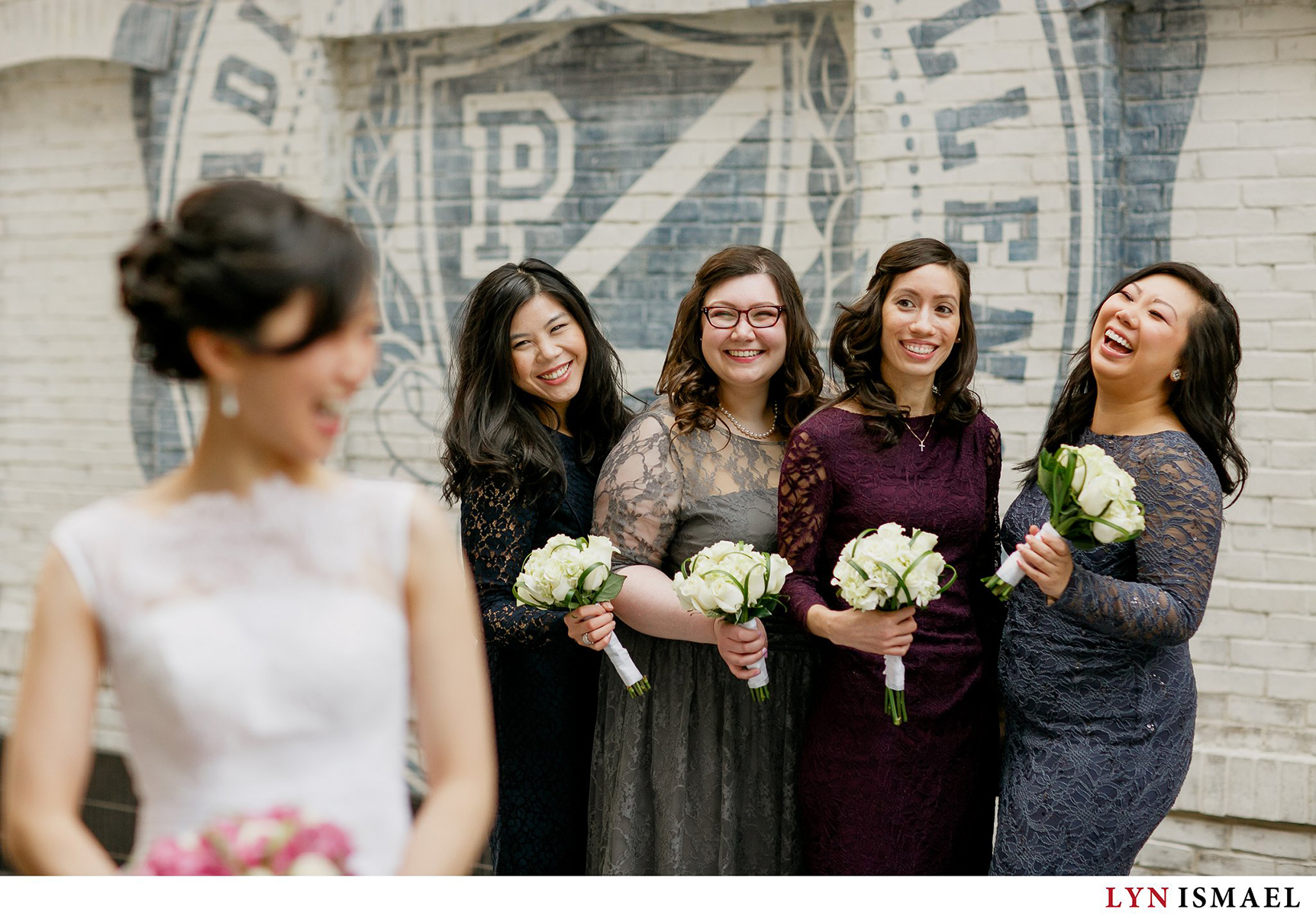 Bridesmaids smile at the bride at the Eaton Centre