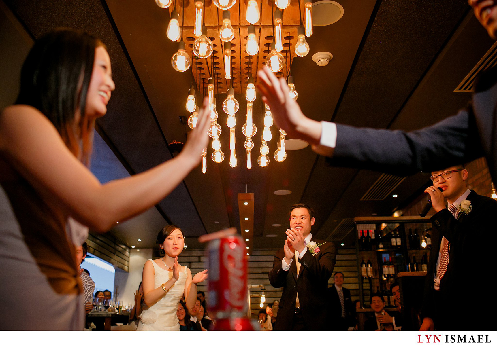 Bride and groom competes with their guests at a wedding at the Reds Wine Tavern in Toronto, Ontario.