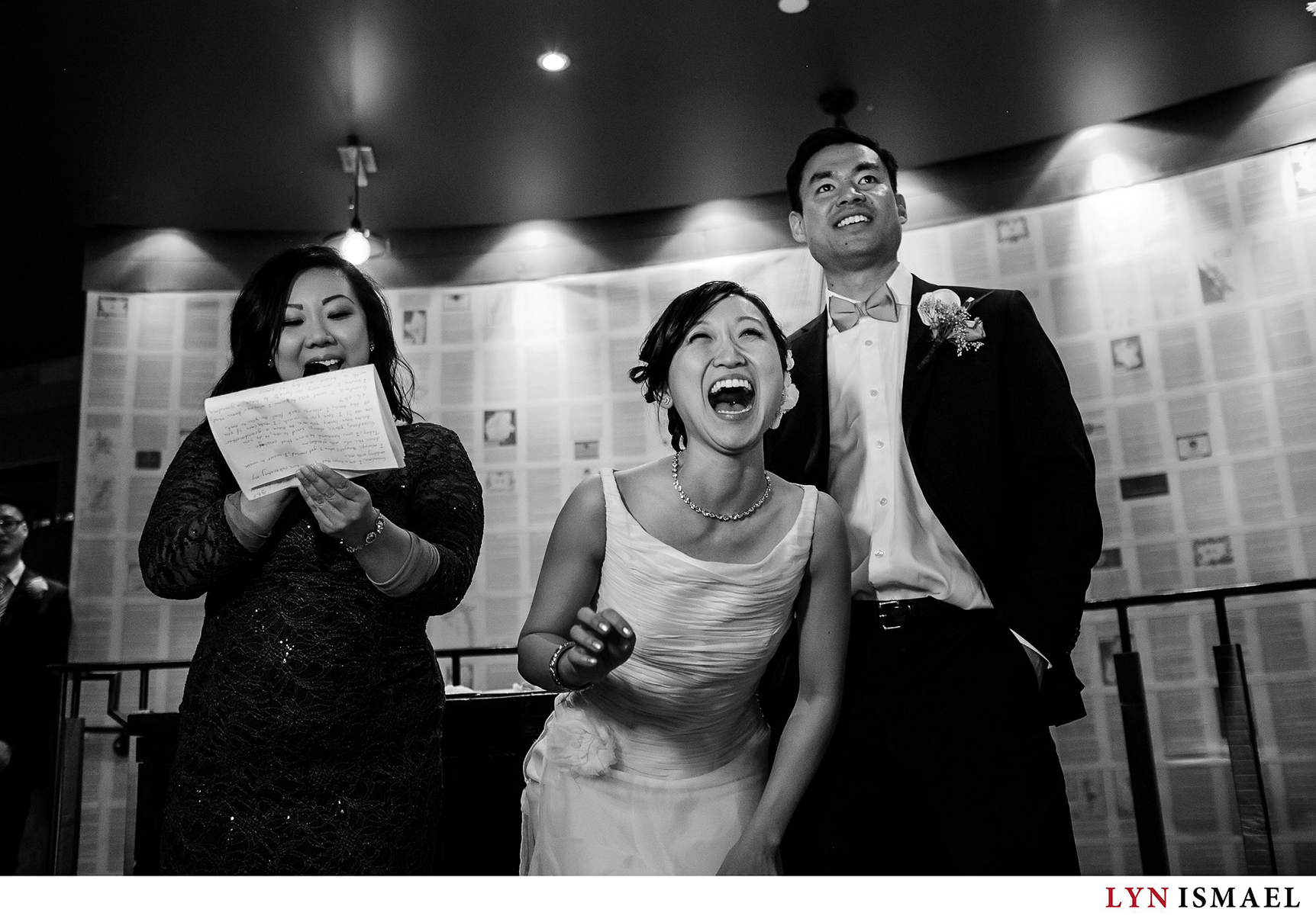 Toronto bride laughs at one of the jokes during her wedding reception at Reds Wine Tavern in Toronto.