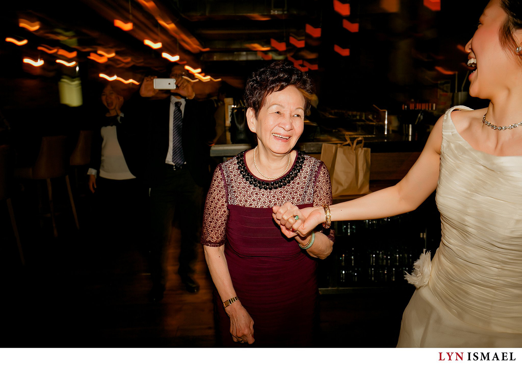 Bride takes her grandmother to the dance floor.