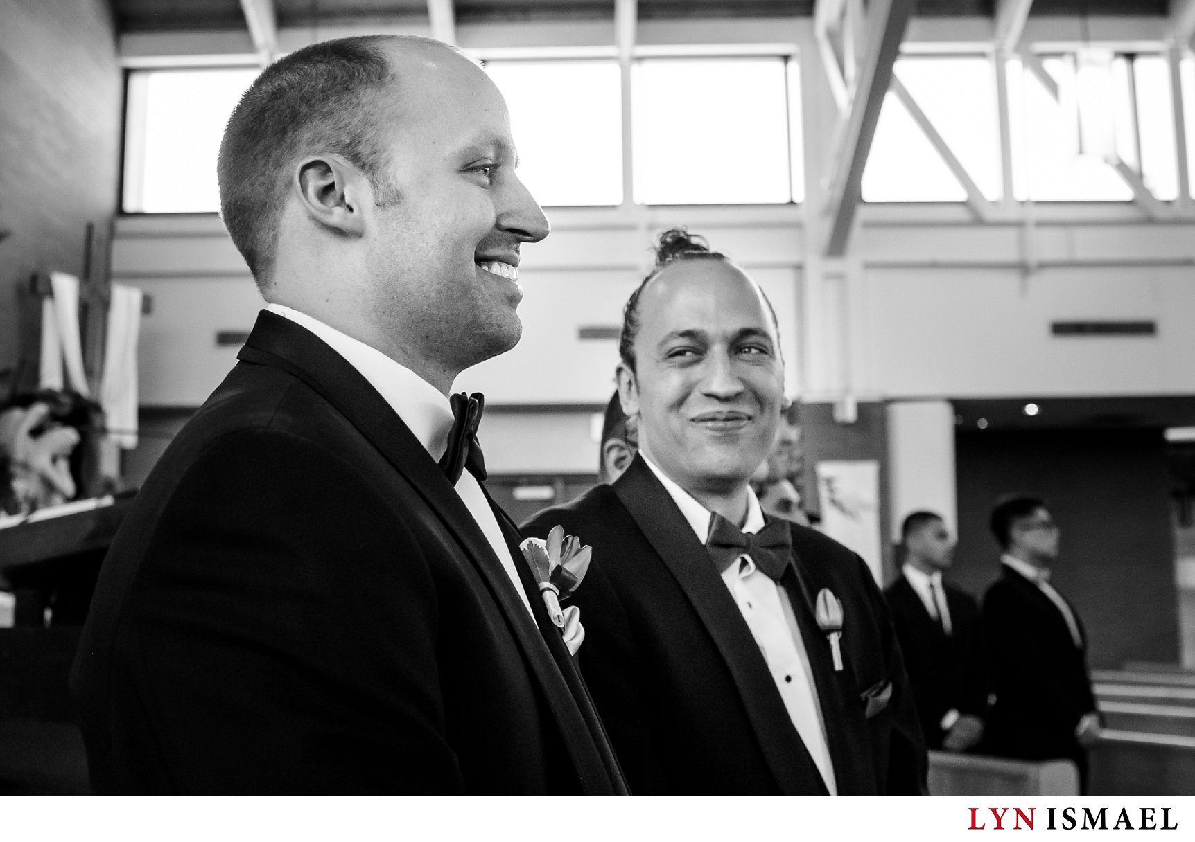 Groom's brother has a happy reaction to watching his brother see his bride walk down the aisle