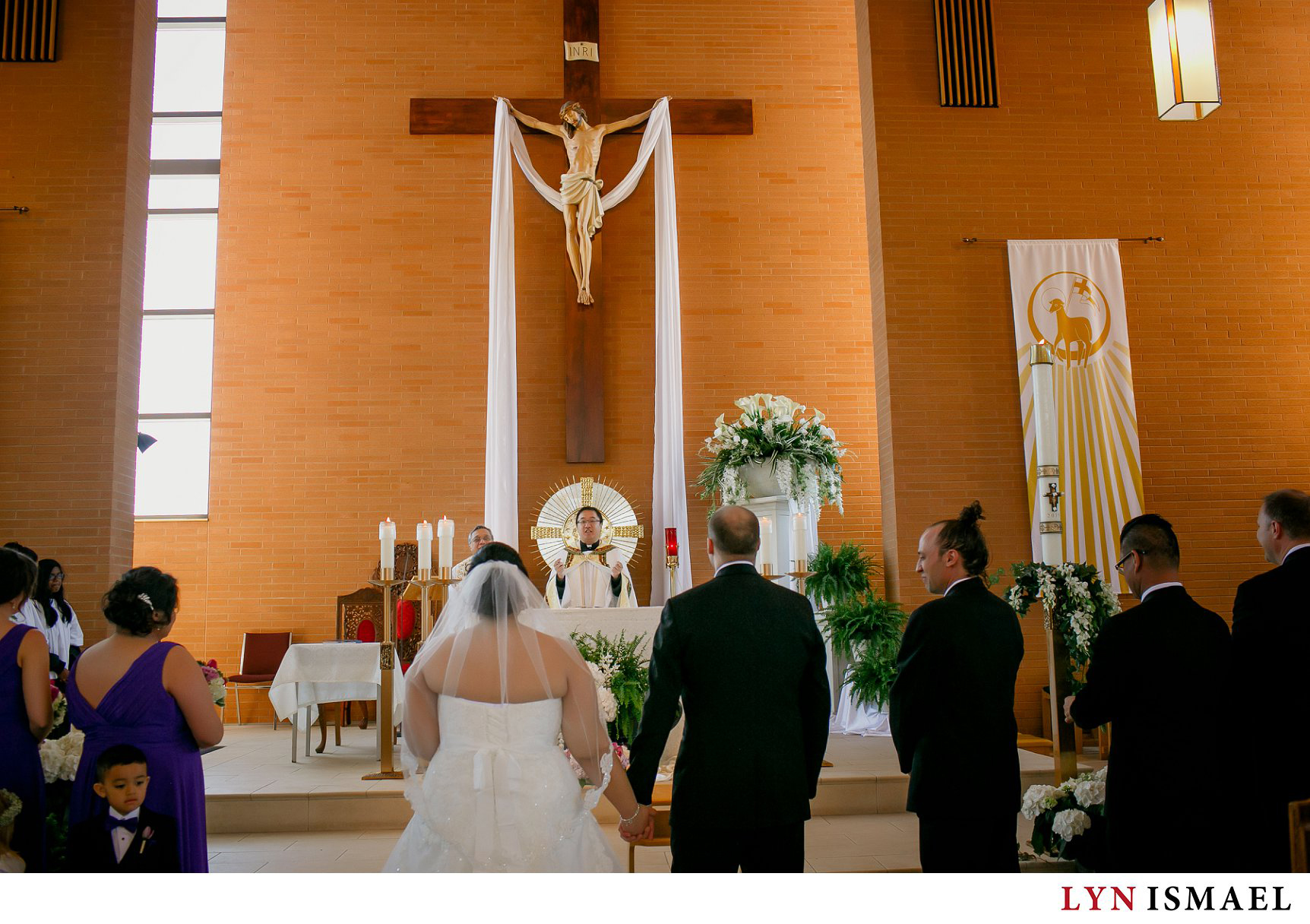 Wedding ceremony at St Francis Xavier Catholic Church in Mississauga, Ontario.