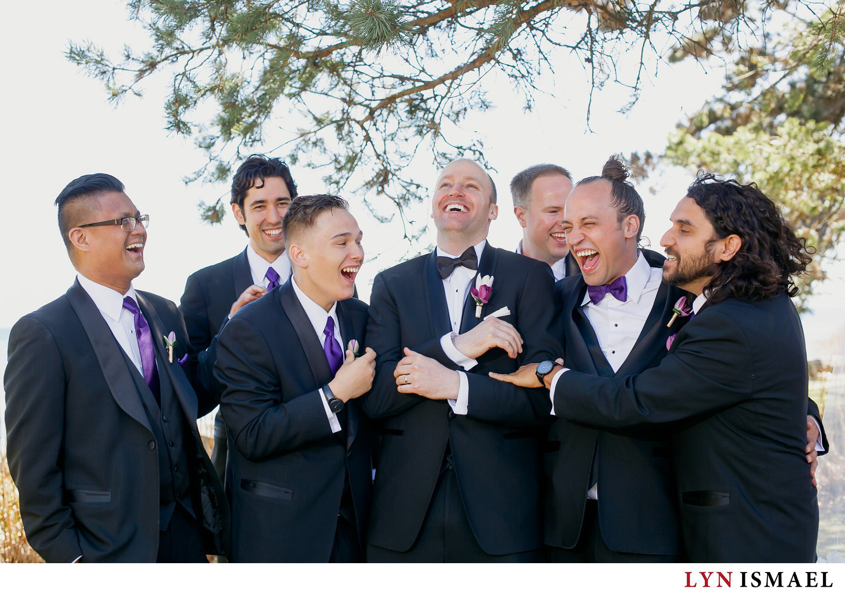 candid portrait of the groom and his groomsmen at Adamson Estate in Mississauga, Ontario.