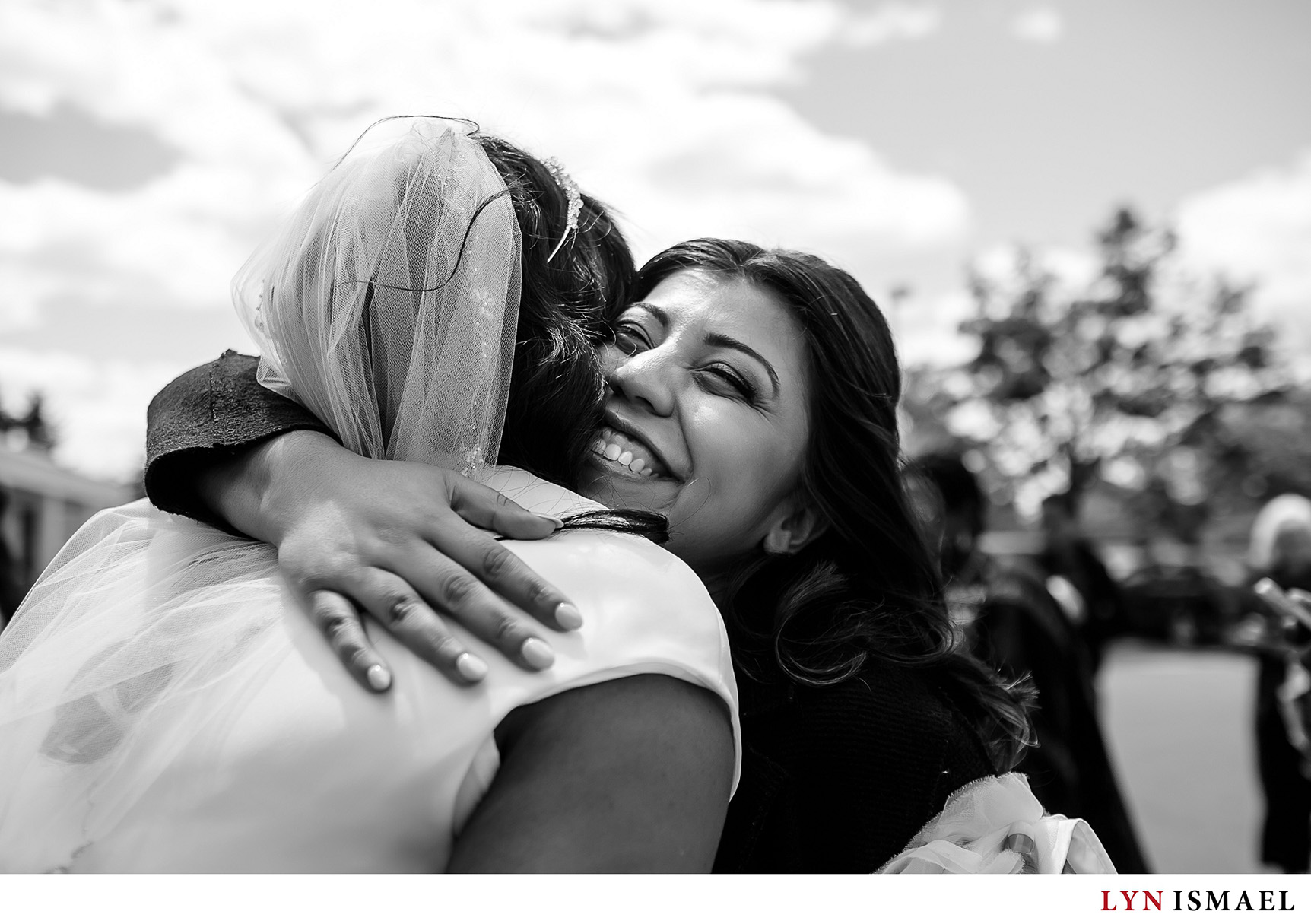 Bride's best friend gives her a hug outside the Toronto Temple