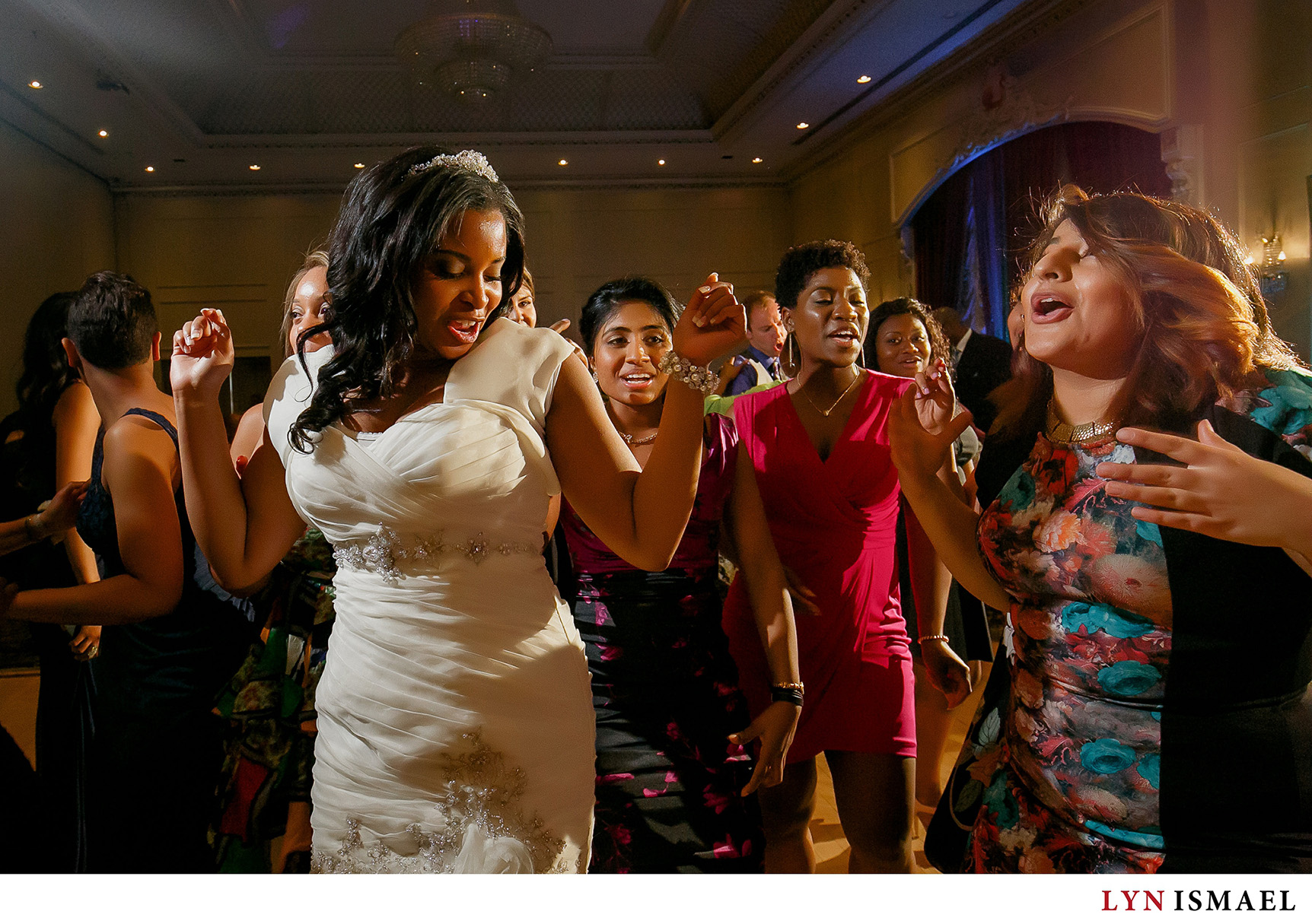 Bride dancing with wedding guests at her wedding at Chateau Le Jardin