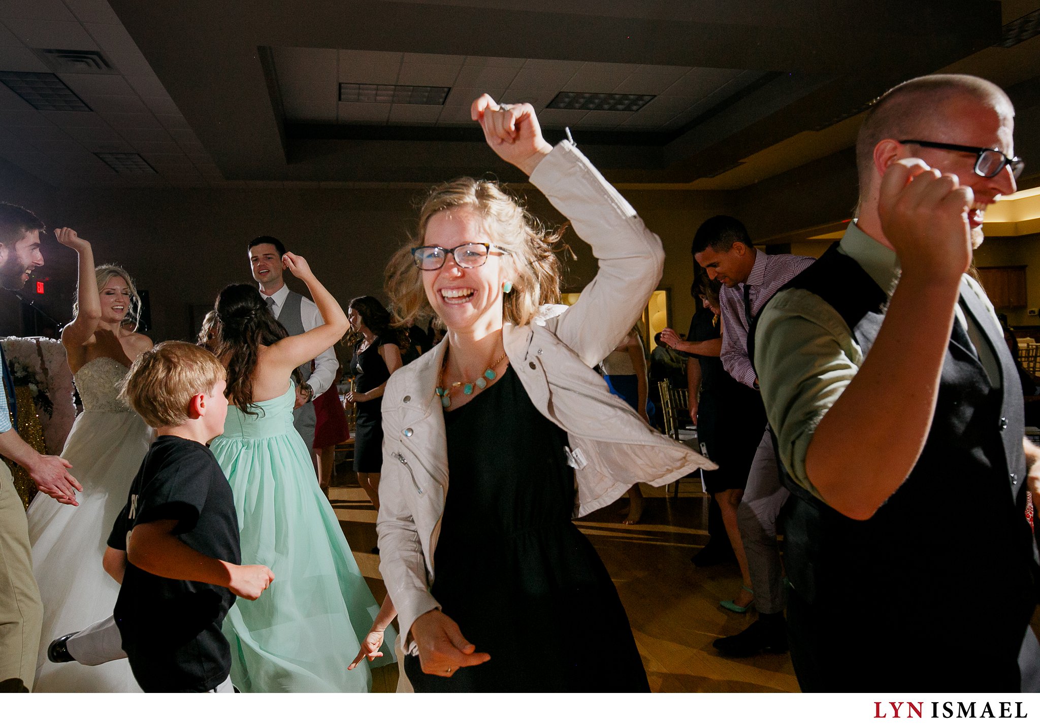 Guest dancing on the dance floor at a wedding at Alma Community Centre