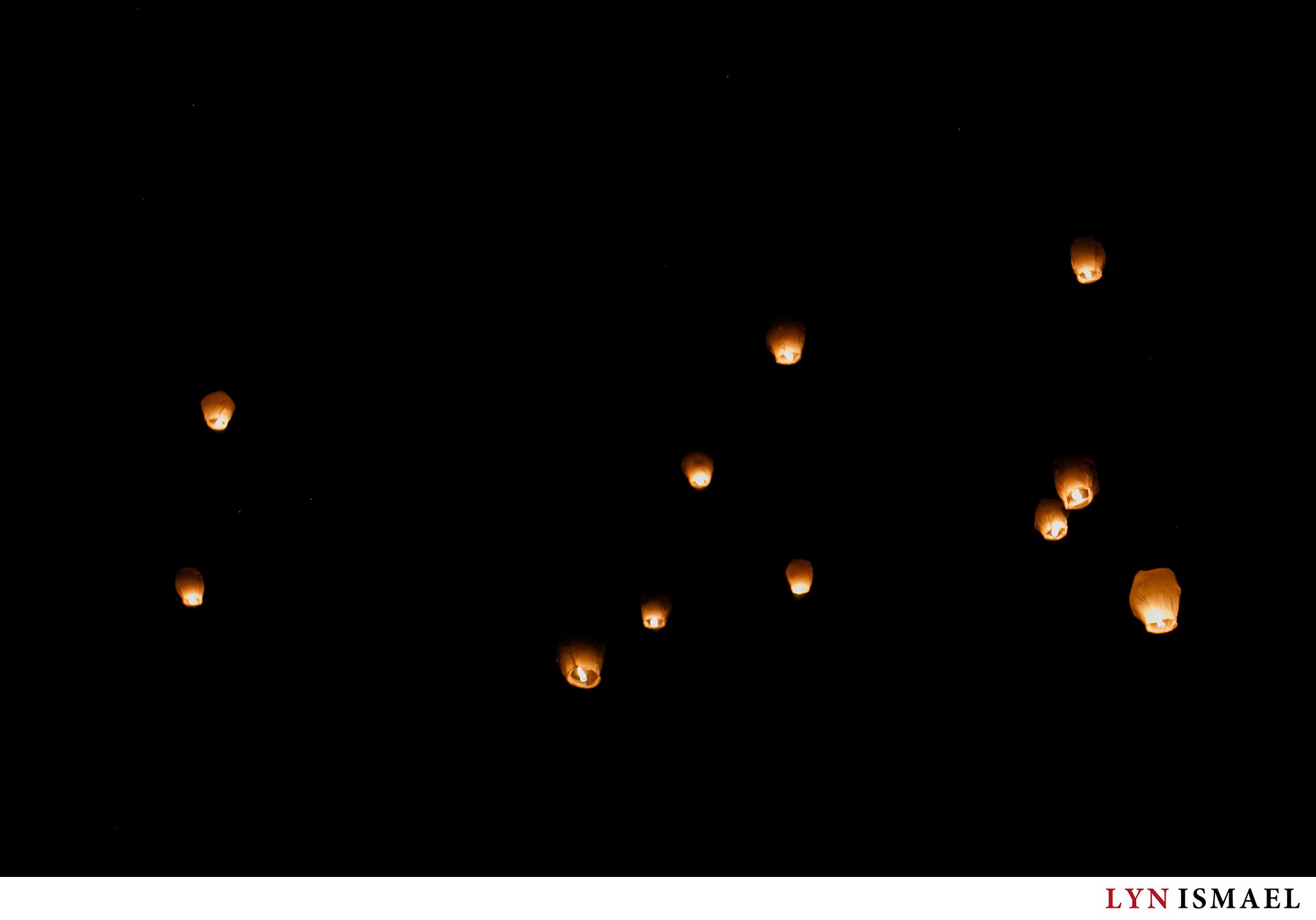 Chinese lanterns floating at night in the sky