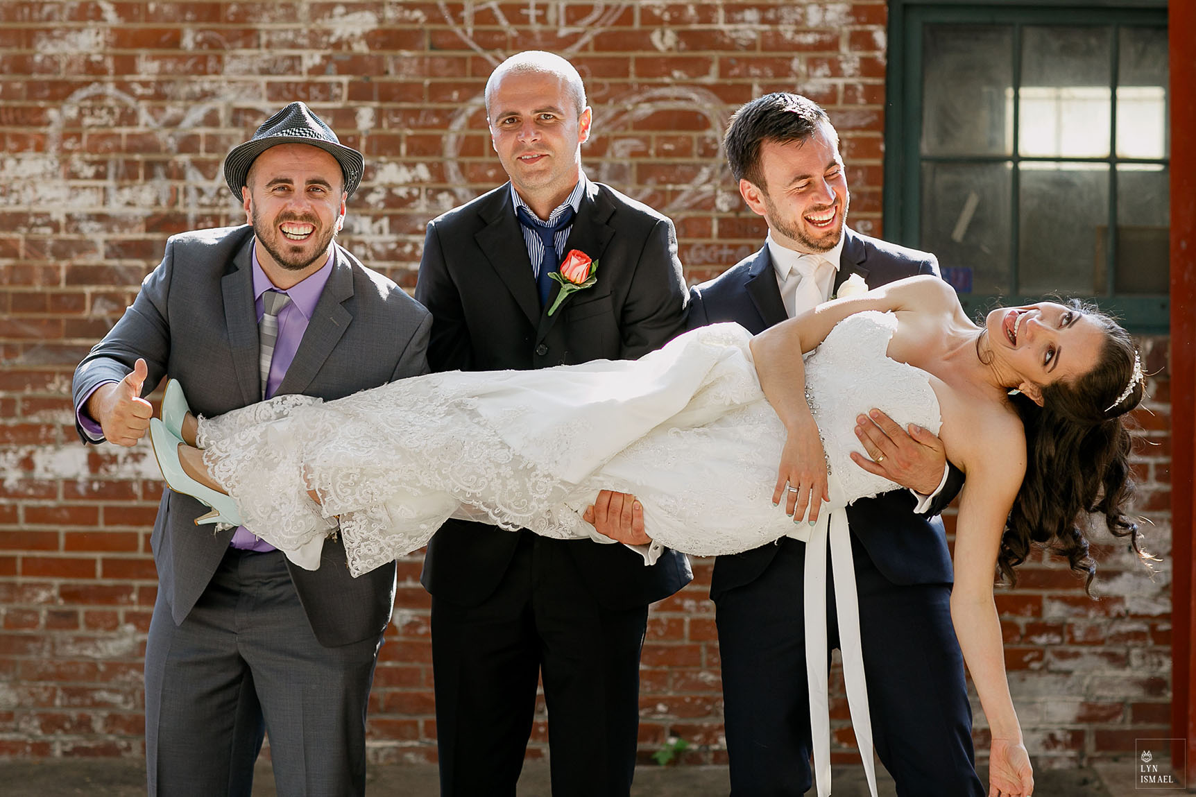 Bride and groom make fun of themselves with the wedding party