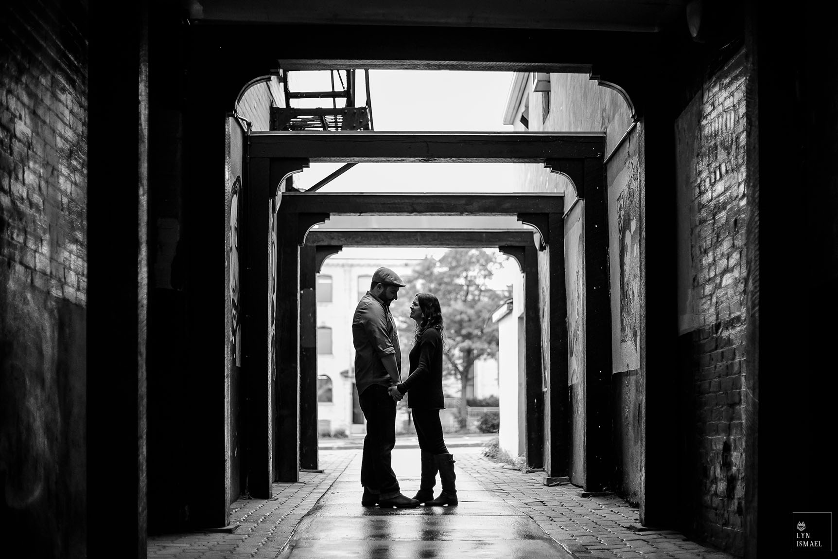 A black and white image of an engaged couple in Downtown Stratford, Ontario.